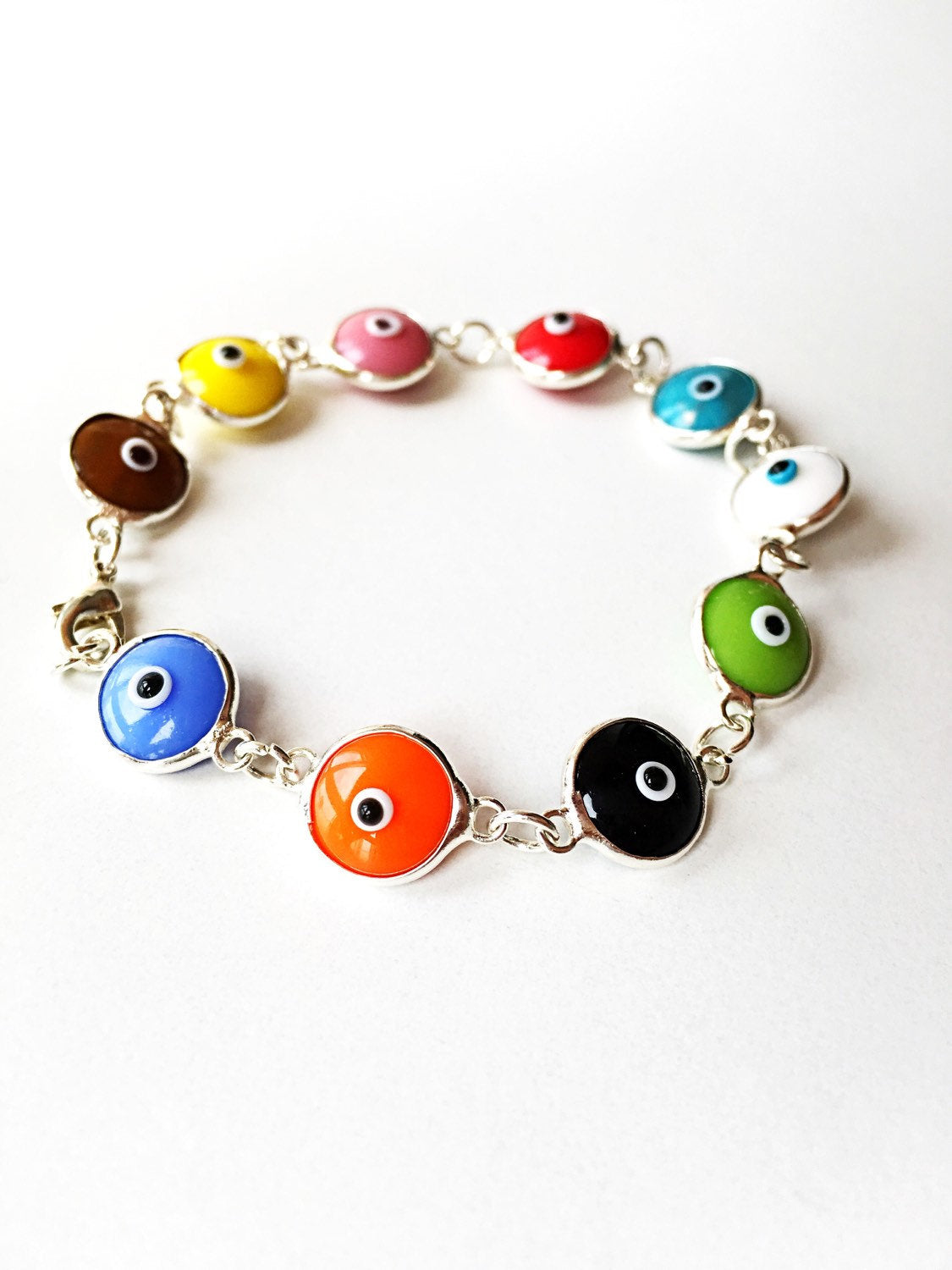 Colorful Glass Evil Eye Bracelet featuring vibrant charms on a durable Murano chain, perfect for protection and style.