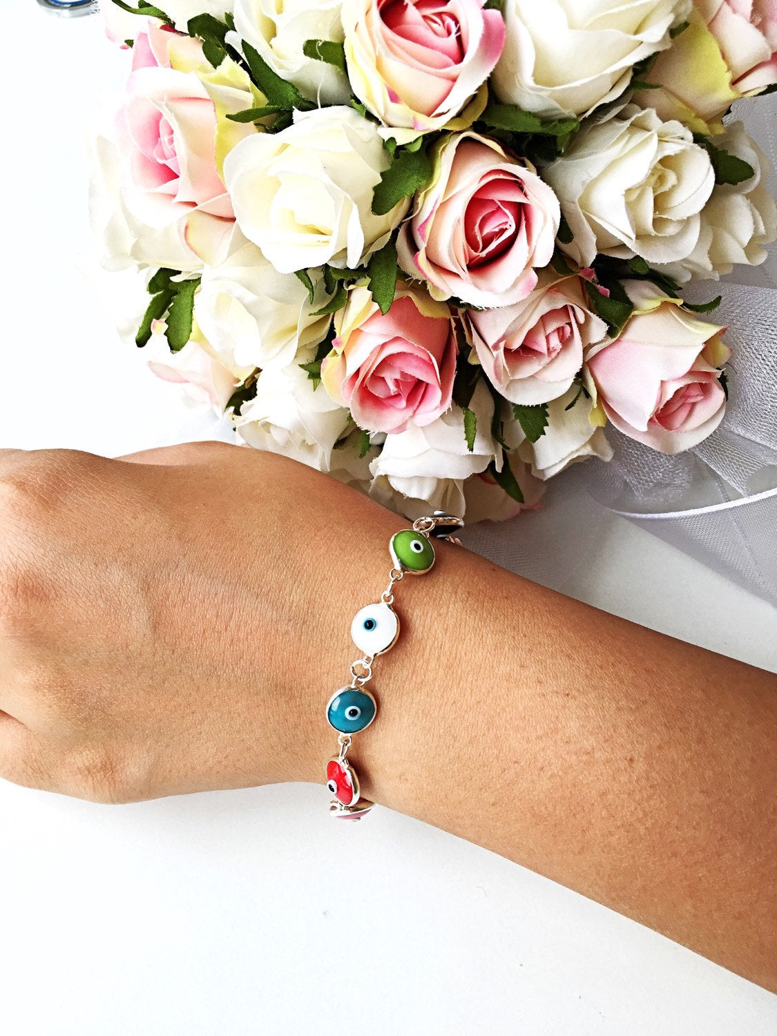 Colorful Glass Evil Eye Bracelet featuring vibrant charms on a durable Murano chain, perfect for protection and style.