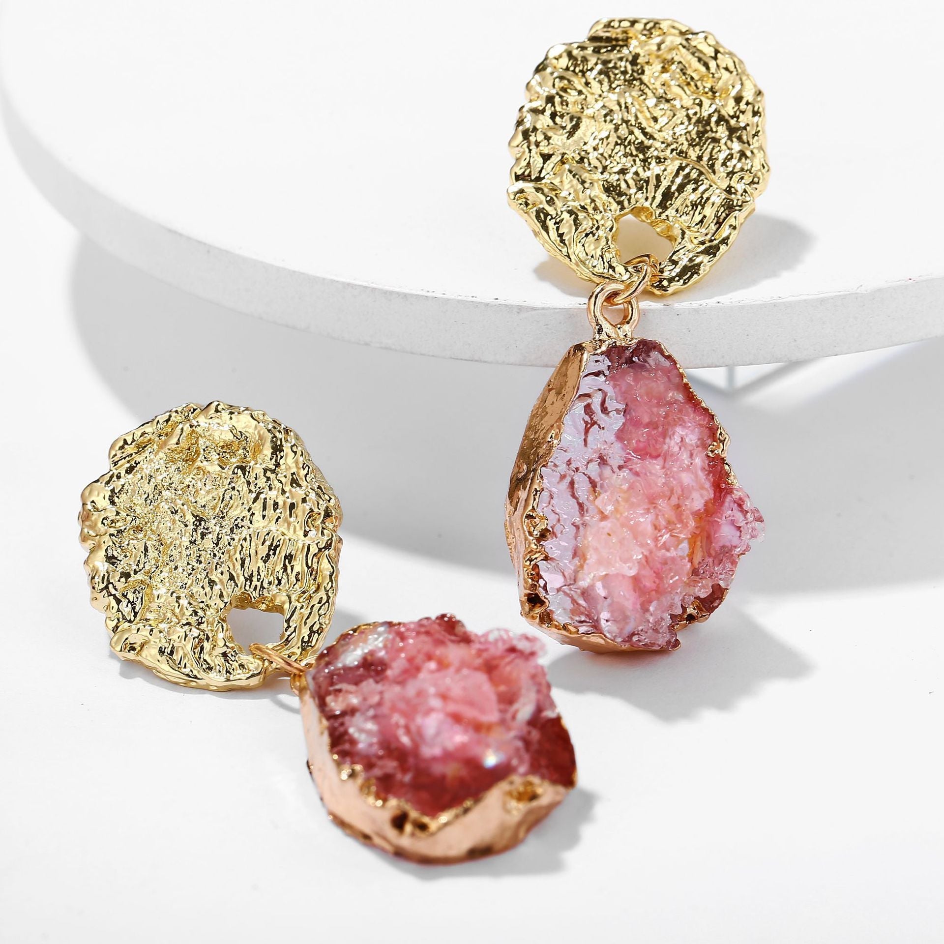 Elegant pink glass stone drop earrings with 18K gold plating, showcasing a luxurious design perfect for any occasion.