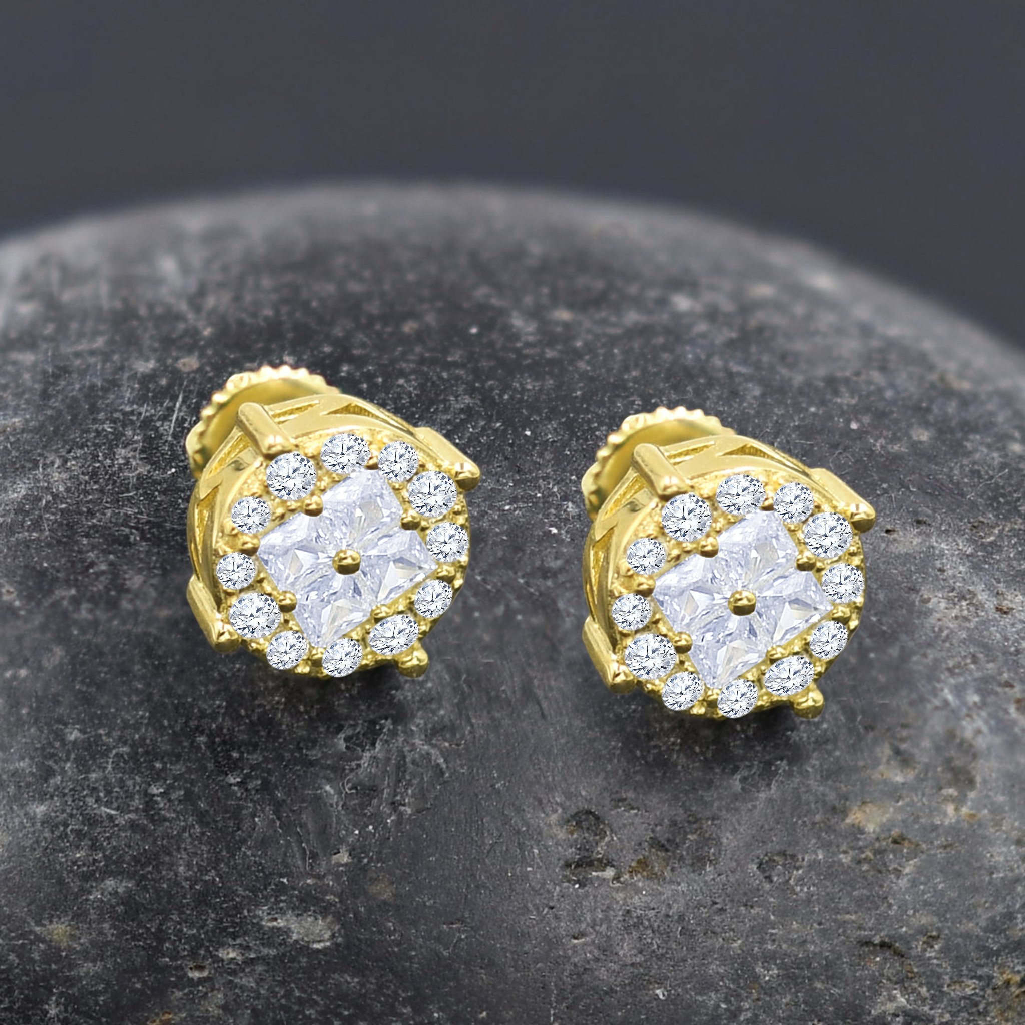 A pair of Glisten Screw Back Earrings featuring diamond-shaped cubic zircon stones set in brass copper metal, showcasing their brilliance and elegance.