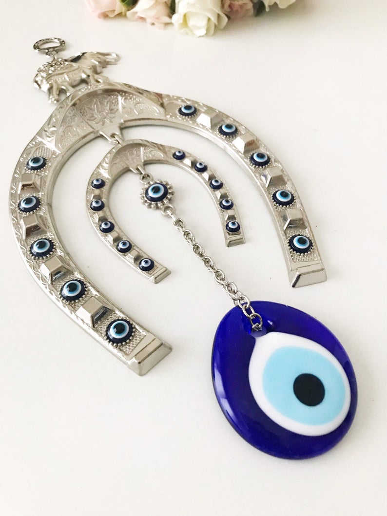 Handmade Good Luck Horseshoe Evil Eye Wall Hanging featuring unique designs and vibrant colors.