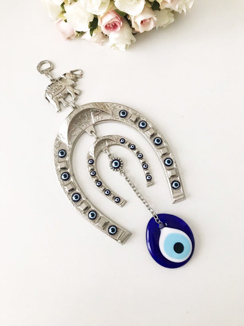 Handmade Good Luck Horseshoe Evil Eye Wall Hanging featuring unique designs and vibrant colors.