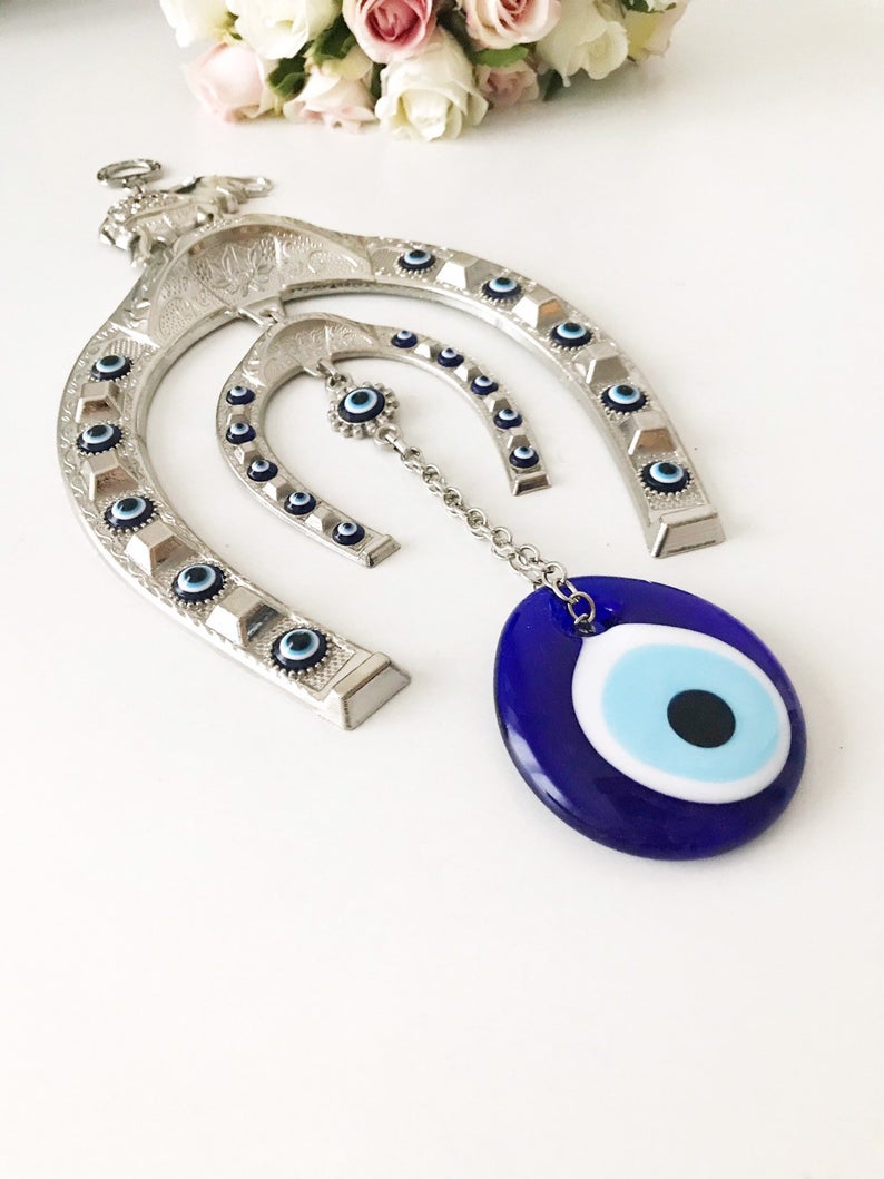 Handmade Good Luck Horseshoe Evil Eye Wall Hanging featuring unique designs and vibrant colors.