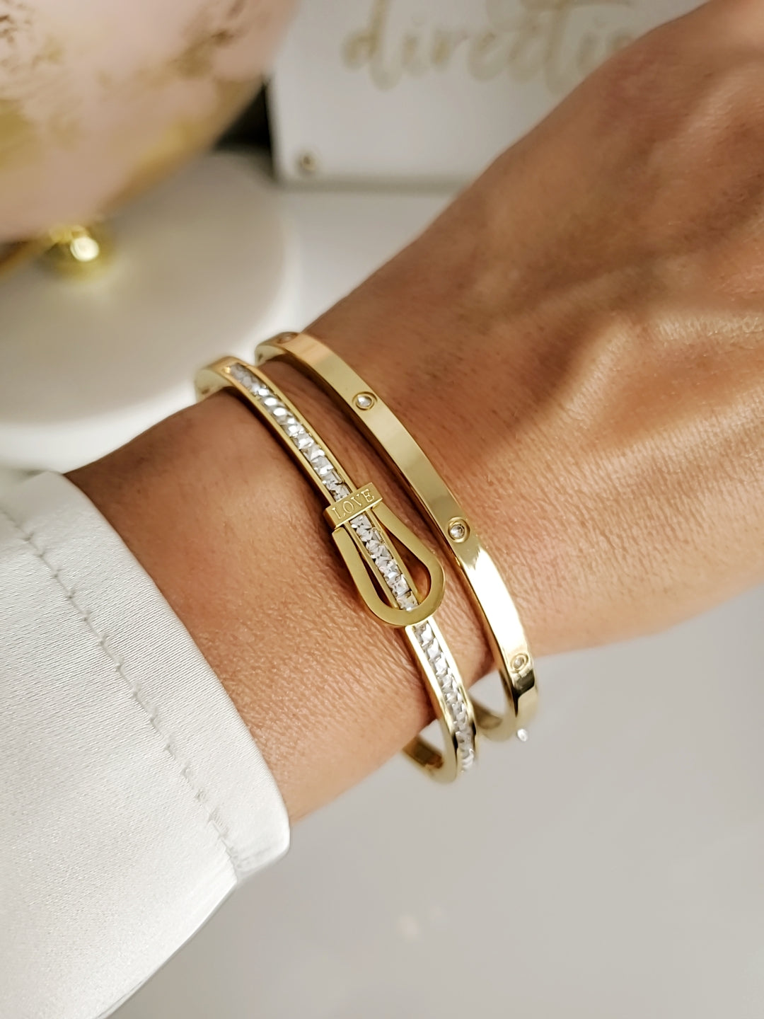 Elegant Gold Belt Bangle made of 316L stainless steel with simulated diamonds, featuring a unique belt design and snap-on closure.