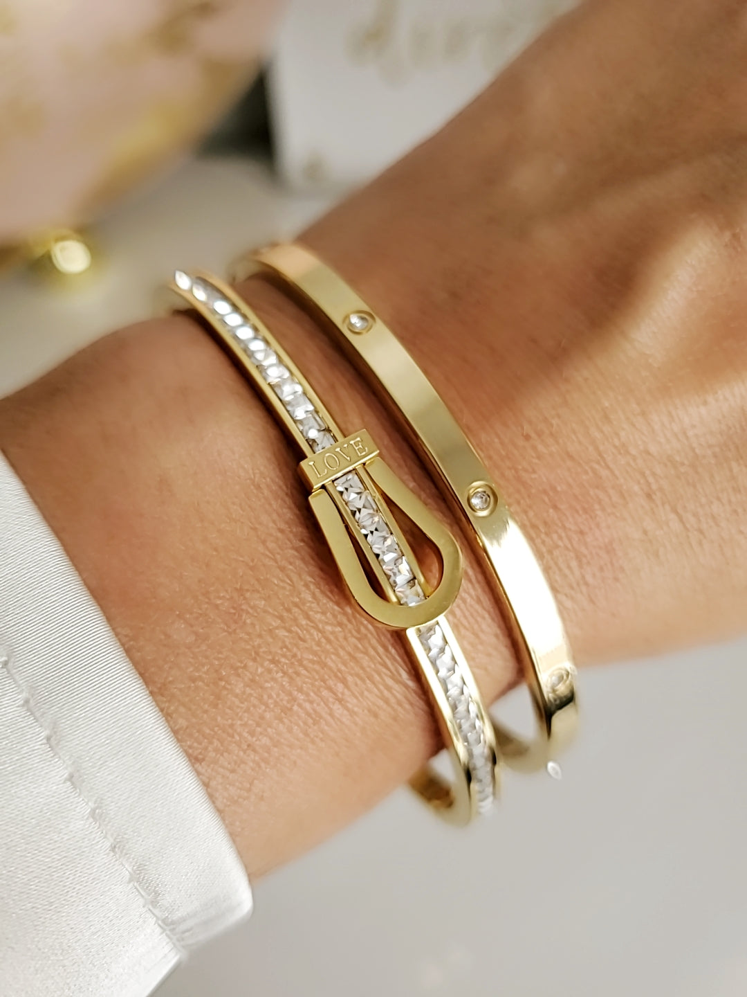 Elegant Gold Belt Bangle made of 316L stainless steel with simulated diamonds, featuring a unique belt design and snap-on closure.