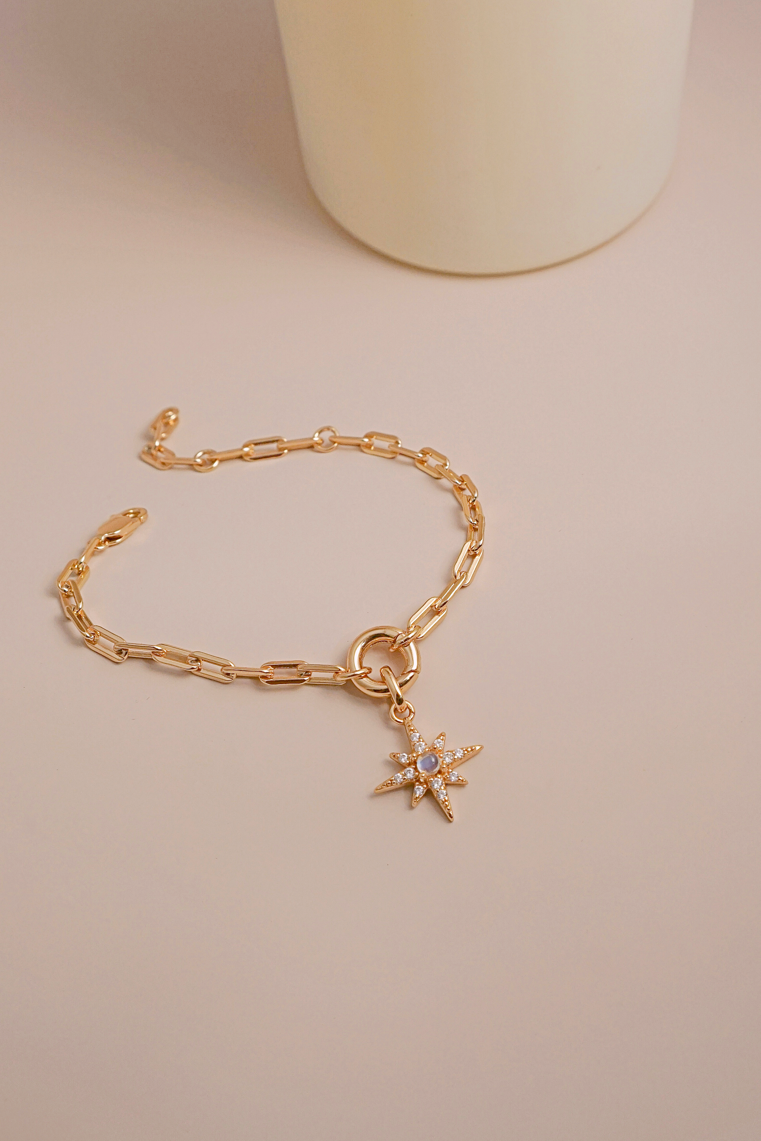 Gold Charm Carrier Bracelet Chain featuring a sleek design with a charm carrier mechanism, perfect for personalizing with various charms.