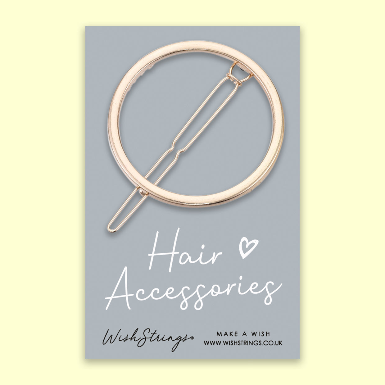 Gold Circle Hair Slide featuring a sleek metal alloy design, elegantly presented on a grey card.