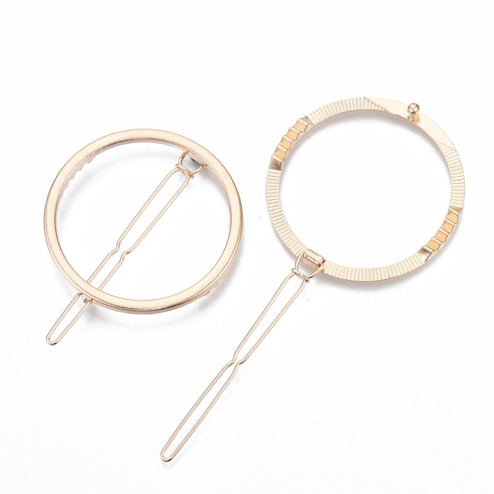 Gold Circle Hair Slide featuring a sleek metal alloy design, elegantly presented on a grey card.