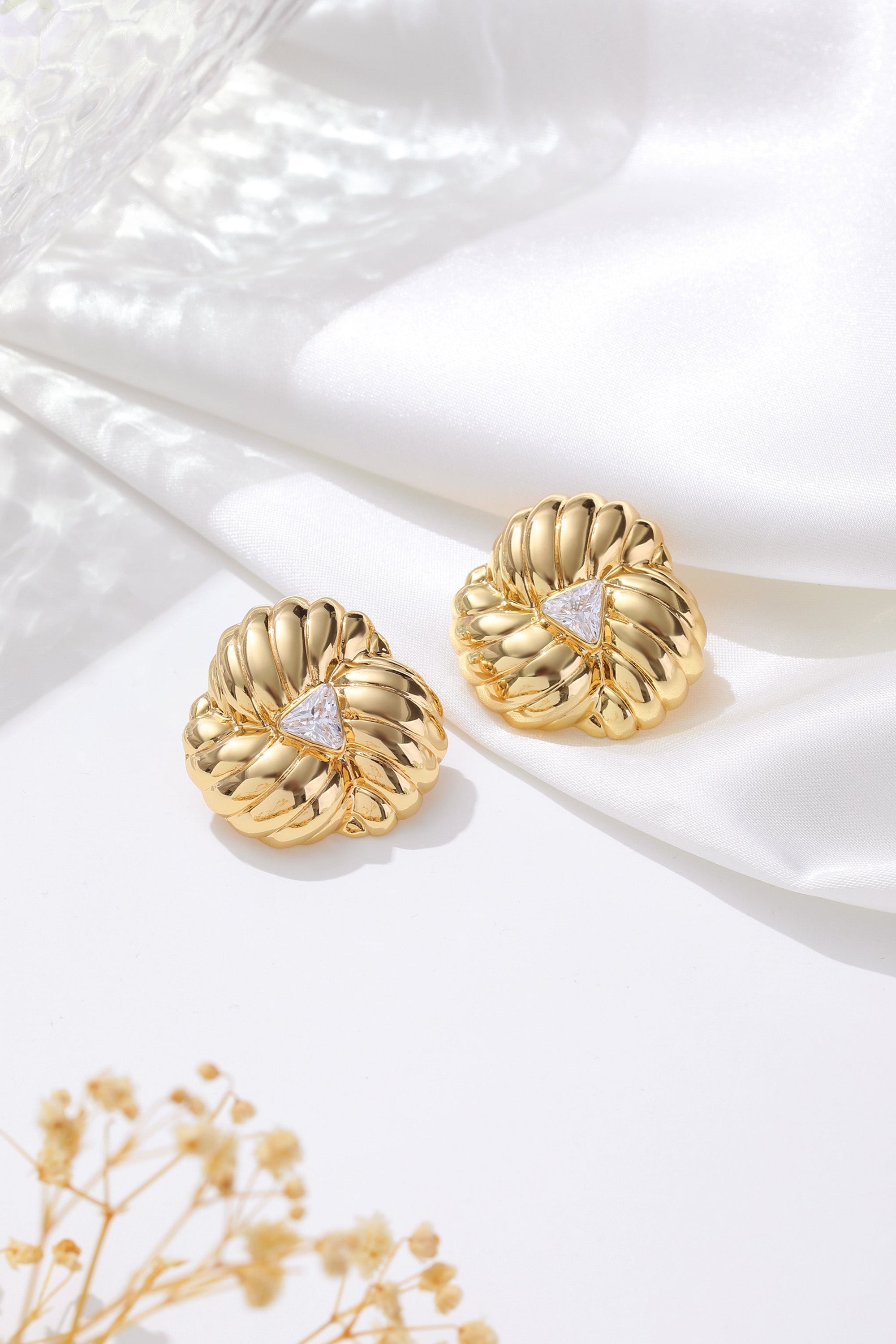 Elegant Gold Clover Designed Stud Earrings featuring sparkling cubic zirconia in a vintage-inspired clover shape.