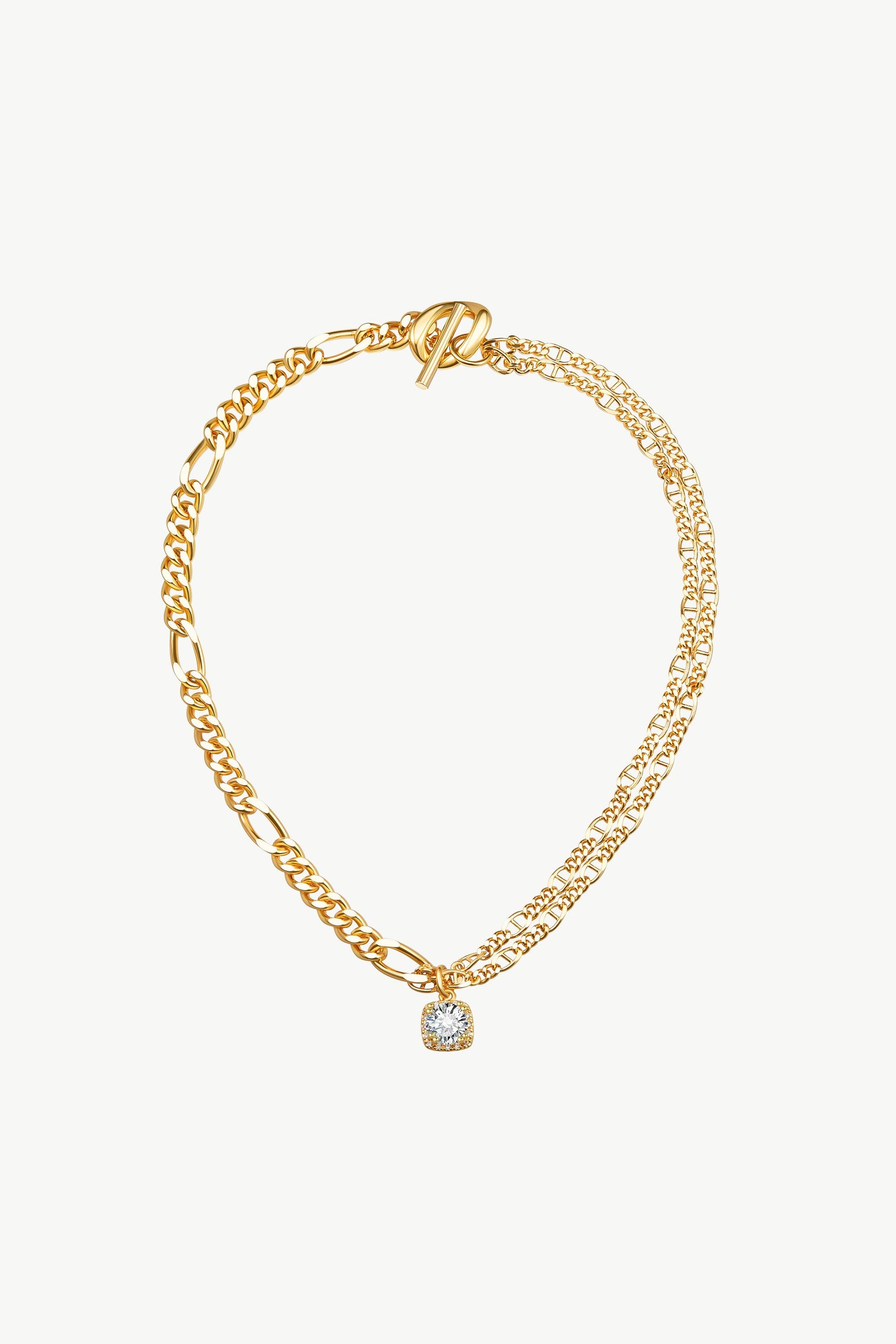 Gold double layered necklace featuring a solitaire cubic zirconia pendant, elegantly designed with sparkling crystals.