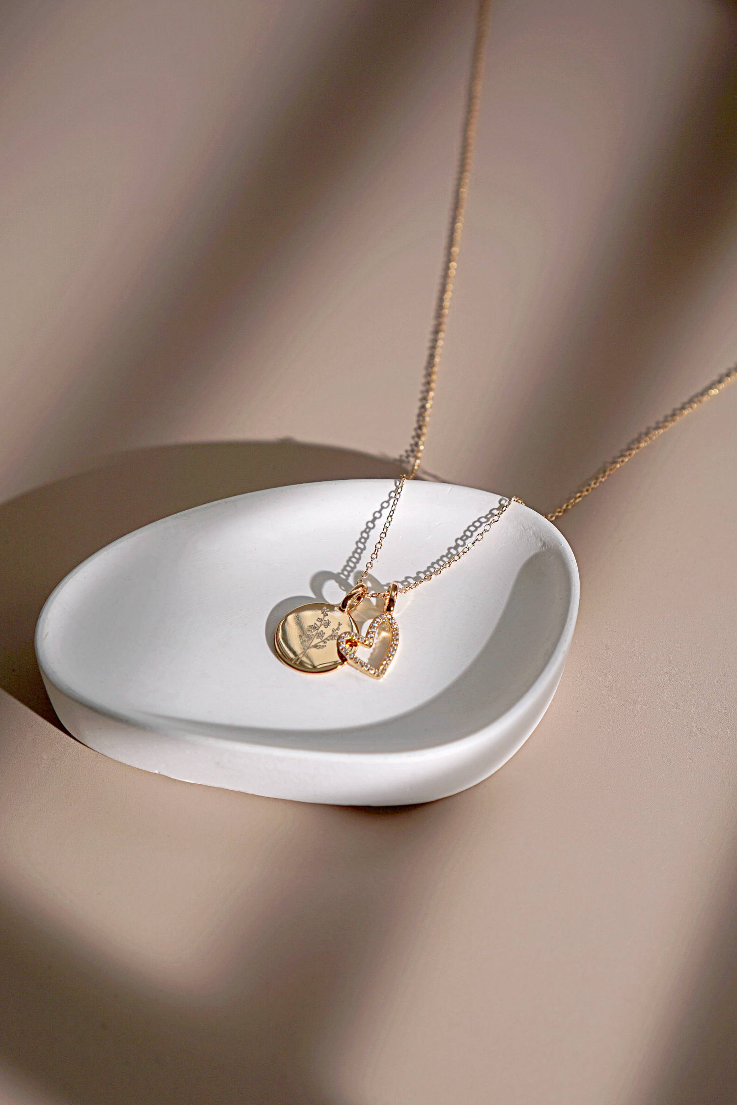 Gold Eternal Heart Necklace featuring a delicate heart-shaped pendant and adjustable chain, symbolizing self-love and appreciation.