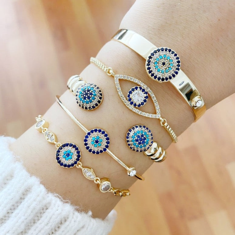 Gold Evil Eye Bracelet featuring a zircon evil eye bead, handmade with tarnish-resistant stainless steel, adjustable cuff design.