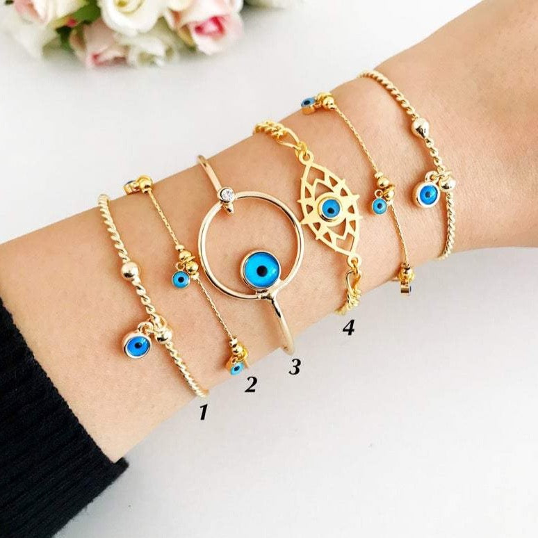 Gold Evil Eye Bracelet featuring a blue evil eye bead, handmade from tarnish-resistant stainless steel, adjustable for a perfect fit.