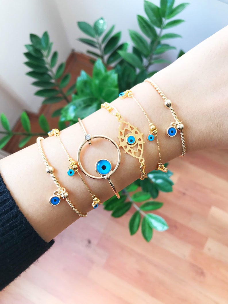 Gold Evil Eye Bracelet featuring a blue evil eye bead, handmade from tarnish-resistant stainless steel, adjustable for a perfect fit.