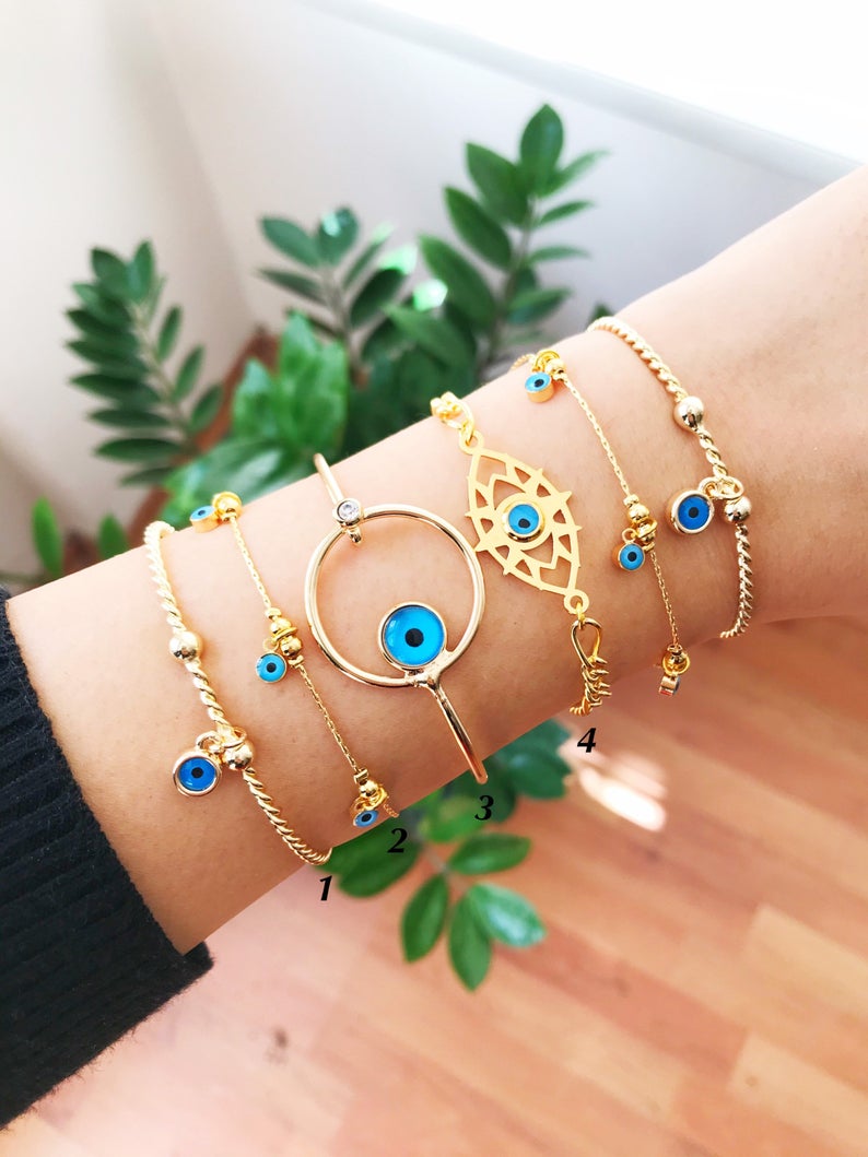 Gold Evil Eye Bracelet featuring a blue evil eye bead, handmade from tarnish-resistant stainless steel, adjustable for a perfect fit.