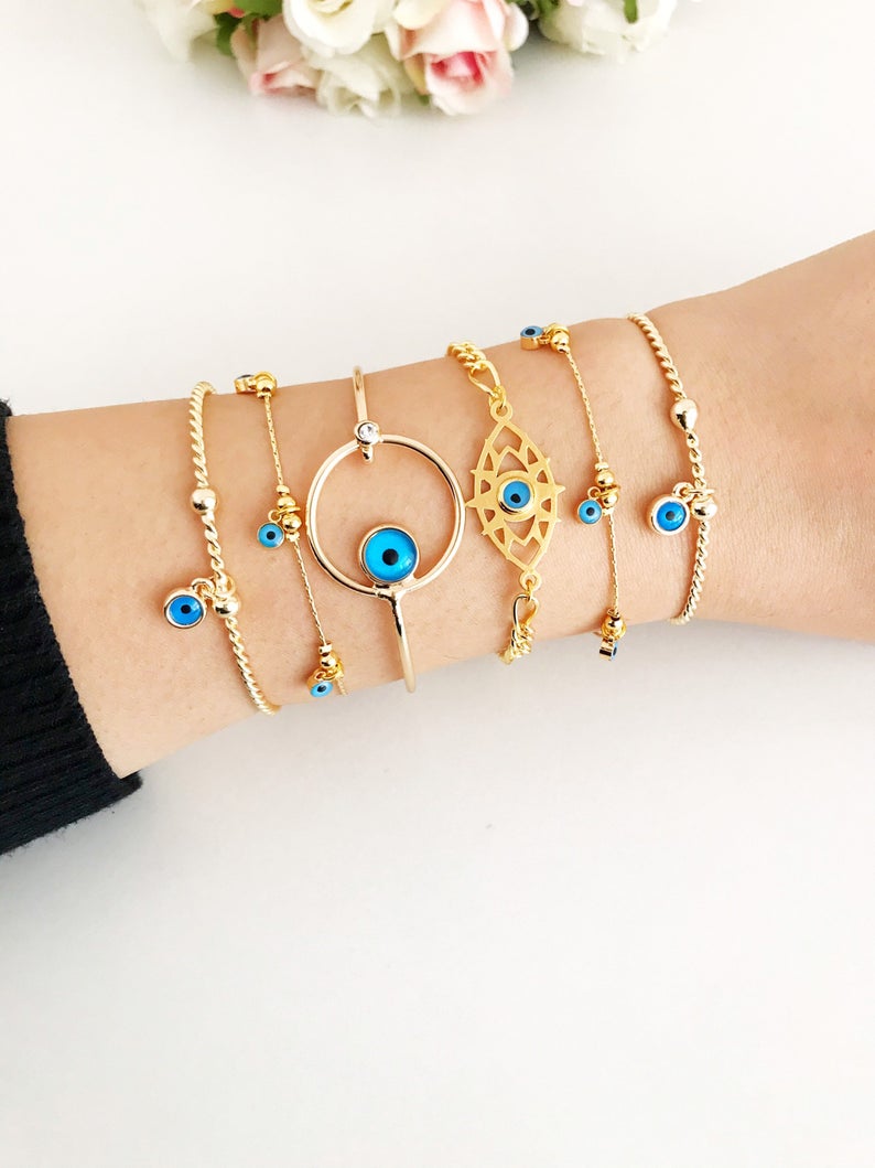 Gold Evil Eye Bracelet featuring a blue evil eye bead, handmade from tarnish-resistant stainless steel, adjustable for a perfect fit.