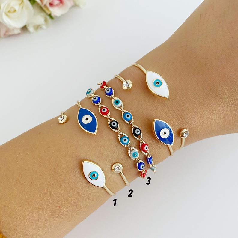 Gold Evil Eye Bracelet featuring multi-color beads and adjustable cuff design, handmade from tarnish-resistant stainless steel.