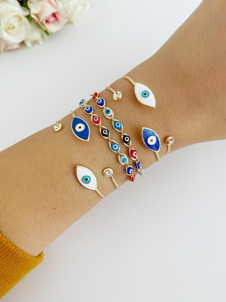 Gold Evil Eye Bracelet featuring multi-color beads and adjustable cuff design, handmade from tarnish-resistant stainless steel.