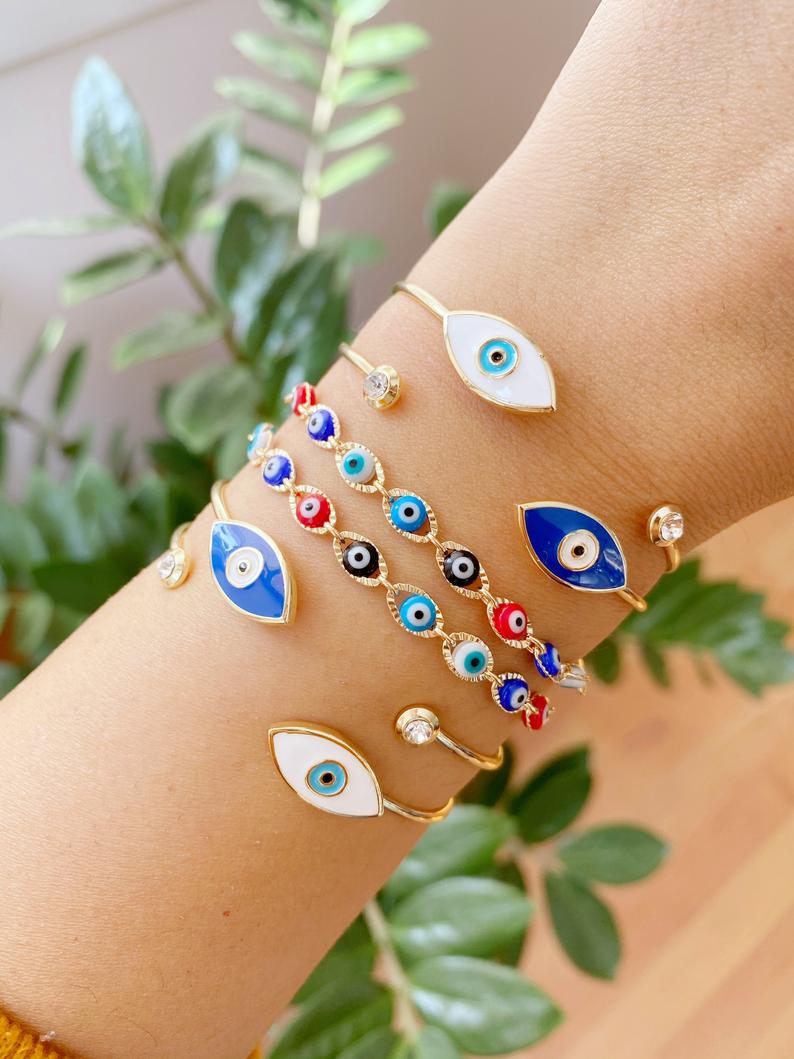 Gold Evil Eye Bracelet featuring multi-color beads and adjustable cuff design, handmade from tarnish-resistant stainless steel.