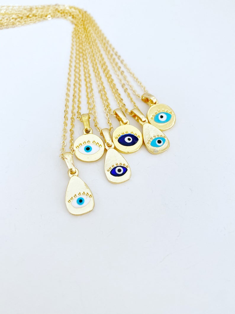 Gold Evil Eye Necklace featuring a tiny evil eye bead and teardrop charm, elegantly designed for protection and style.