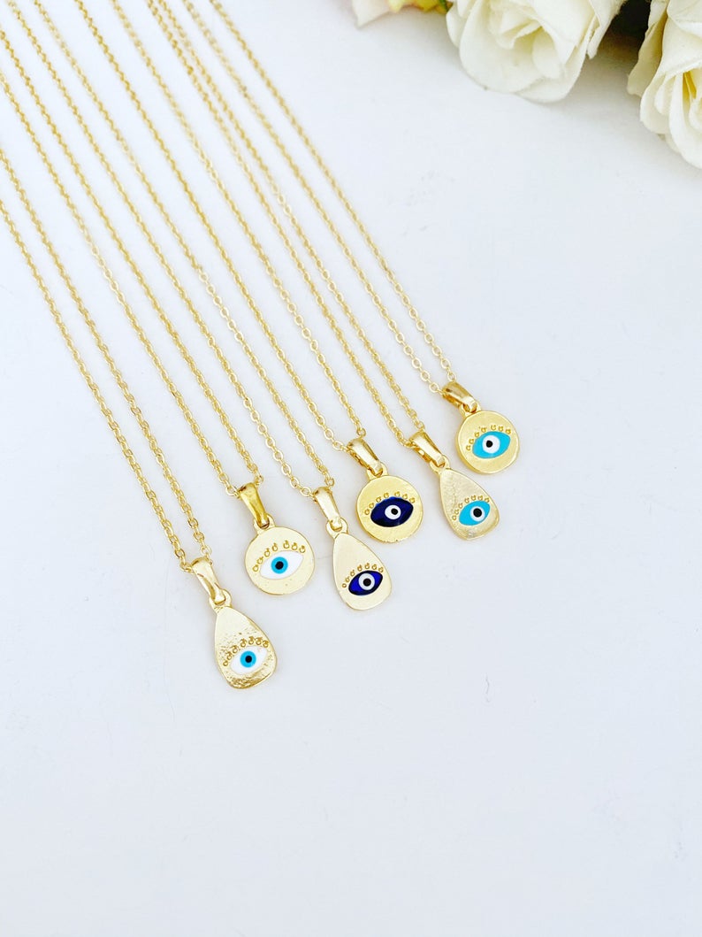 Gold Evil Eye Necklace featuring a tiny evil eye bead and teardrop charm, elegantly designed for protection and style.