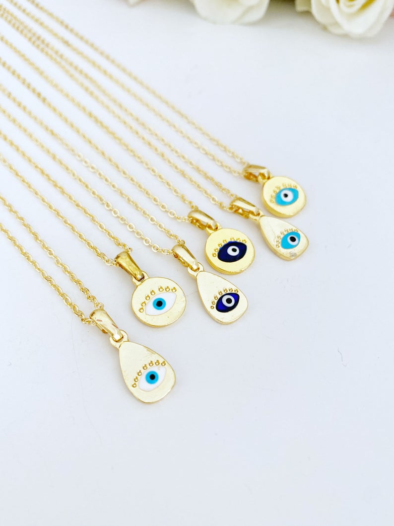 Gold Evil Eye Necklace featuring a tiny evil eye bead and teardrop charm, elegantly designed for protection and style.