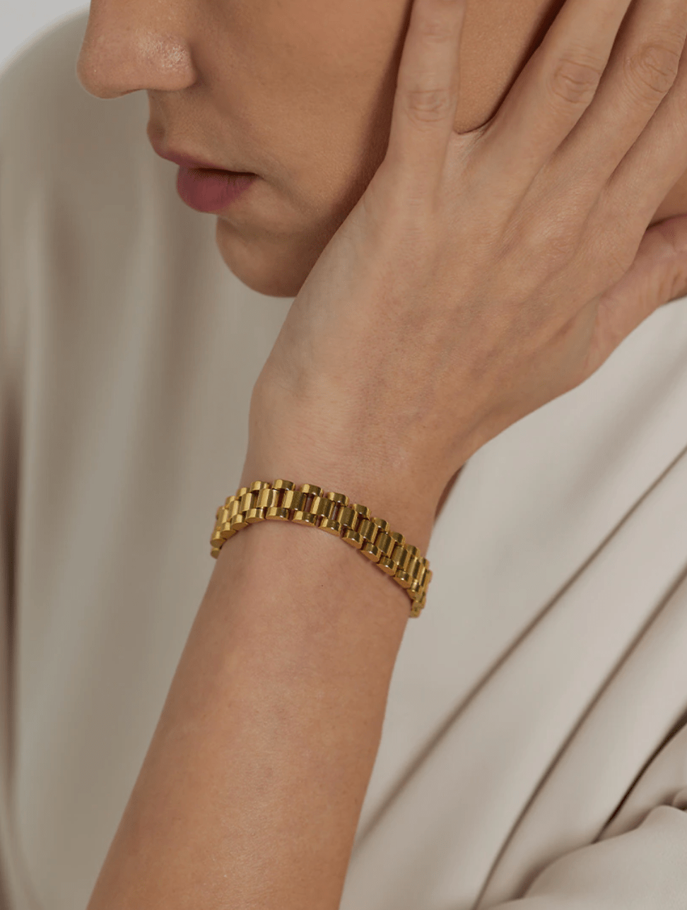 A stylish Gold Flat Chain Chunky Bracelet made of stainless steel with 18K gold plating, showcasing a thick, modern design perfect for any outfit.