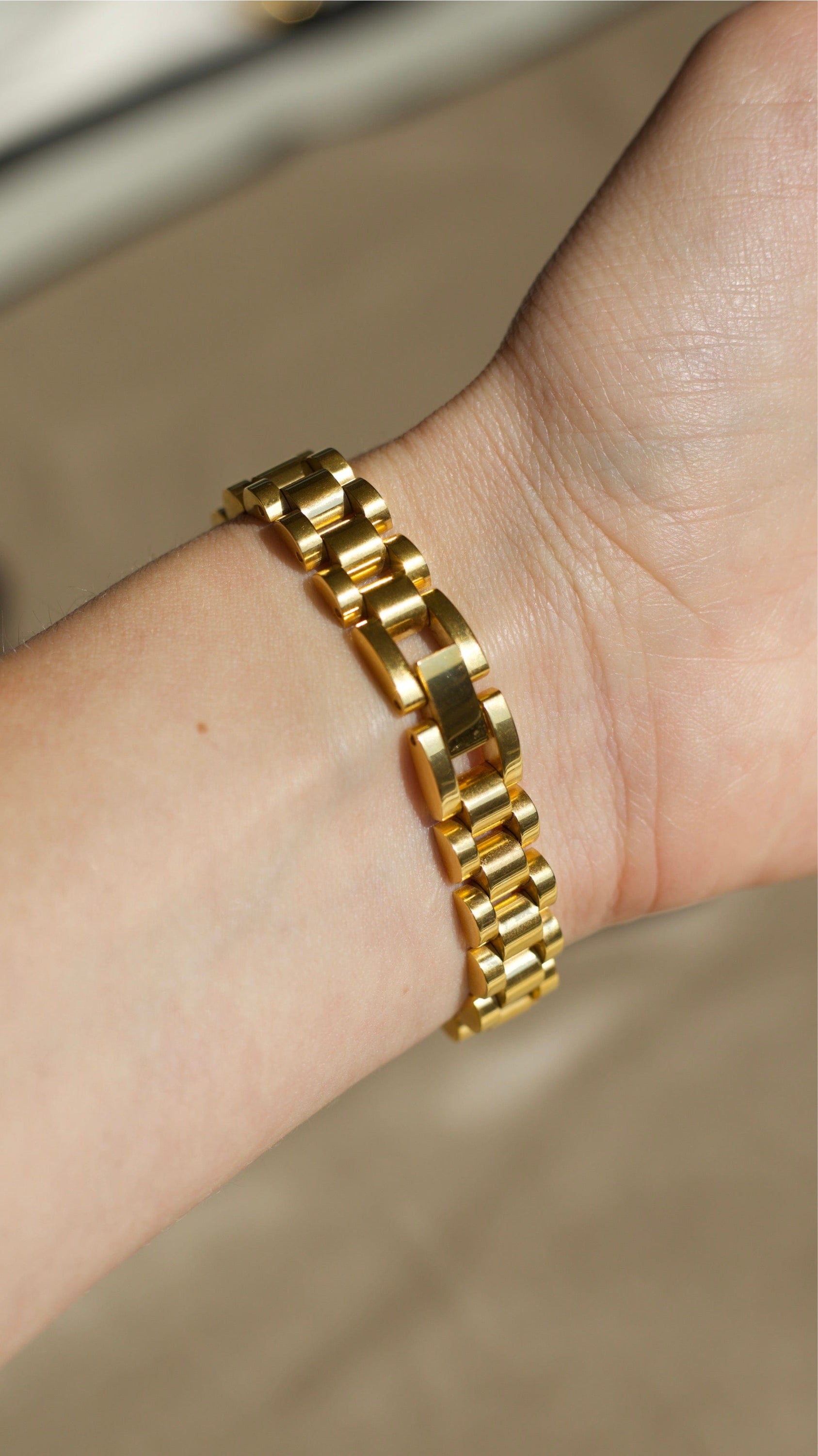 A stylish Gold Flat Chain Chunky Bracelet made of stainless steel with 18K gold plating, showcasing a thick, modern design perfect for any outfit.