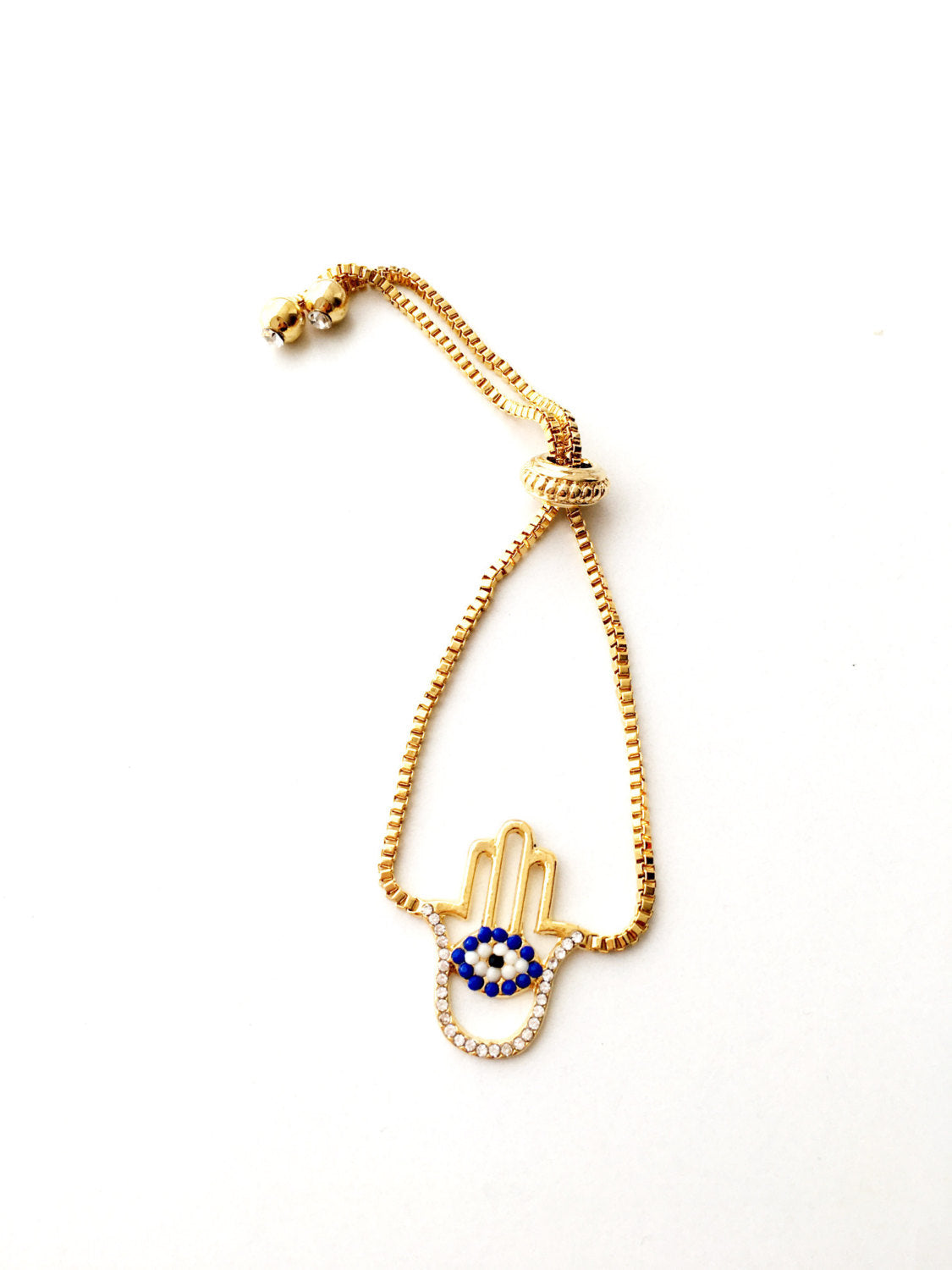 Gold Hamsa Evil Eye Bracelet featuring blue evil eye beads and adjustable stainless steel design.