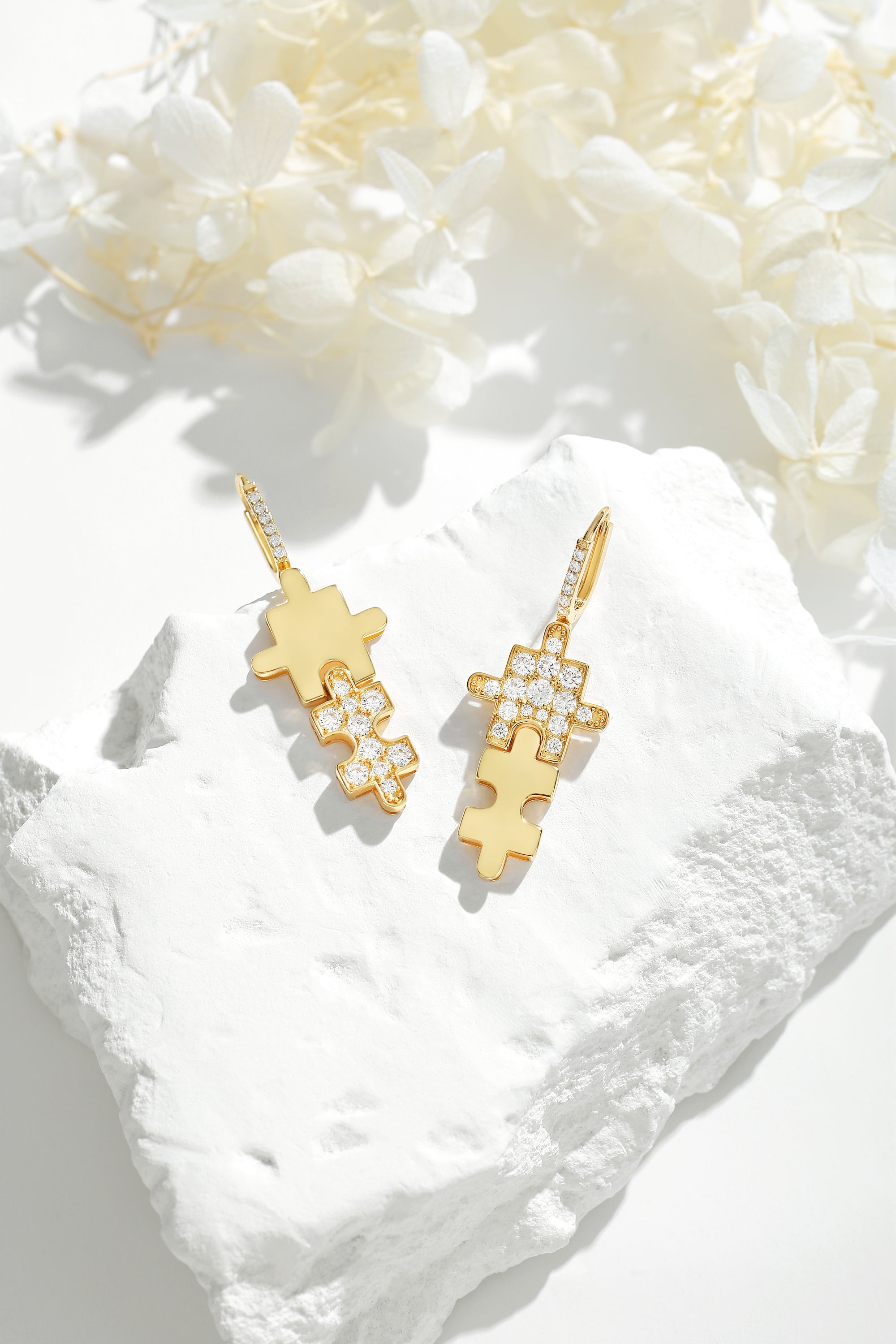 Gold Jigsaw Puzzle Drop Earrings featuring sparkling cubic zirconia stones and huggie hoop design, handcrafted with 18k gold plating.