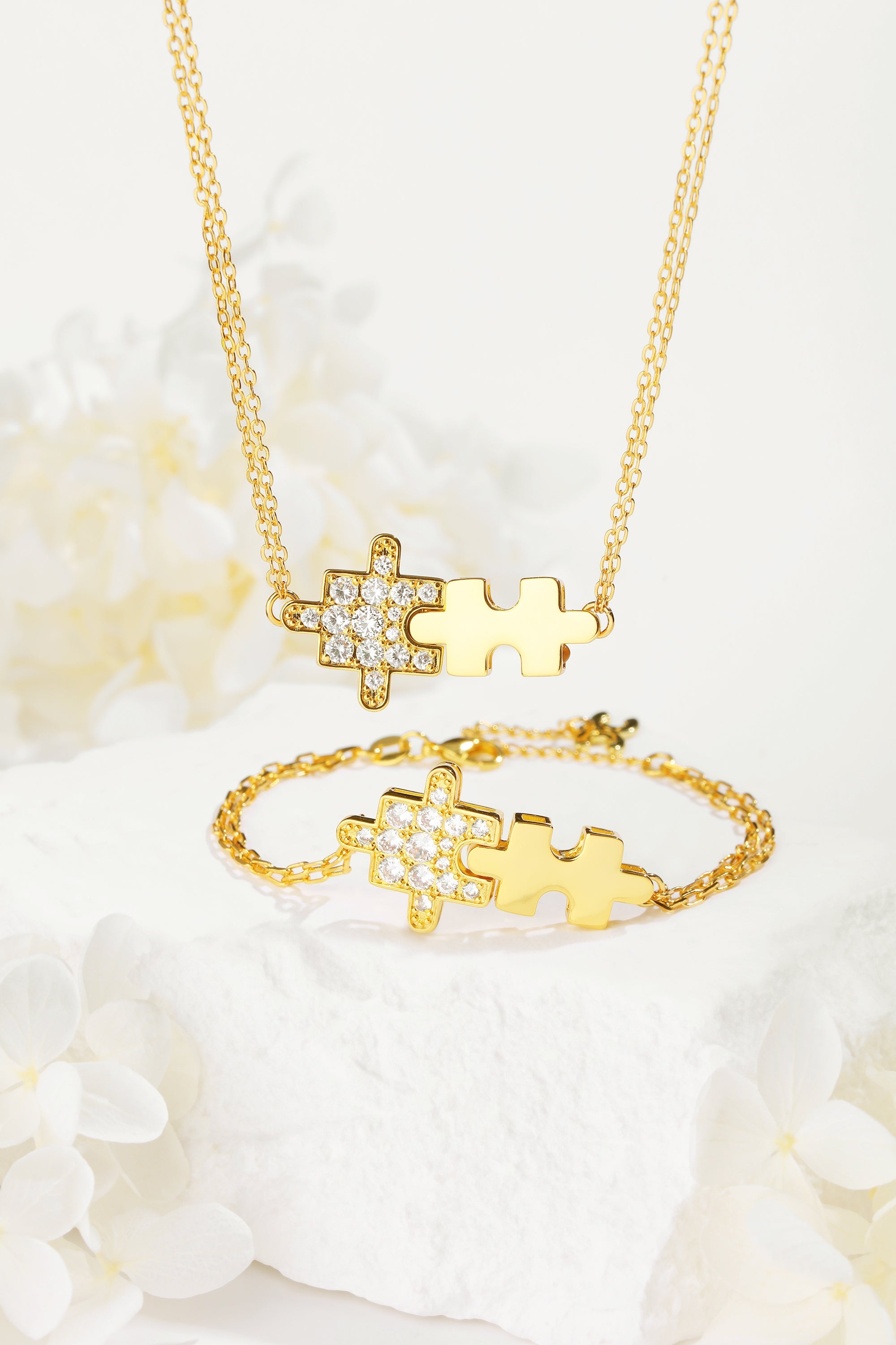 Gold jigsaw puzzle bracelet adorned with sparkling cubic zirconia stones, showcasing a playful design and luxurious 18k gold plating.