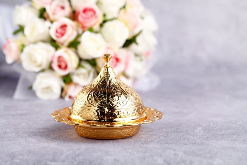 Gold luxury wedding favor box elegantly designed for special occasions, perfect for holding treats and customizable for personal touches.