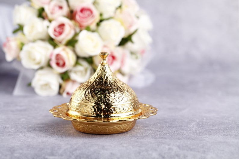 Gold luxury wedding favor box elegantly designed for special occasions, perfect for holding treats and customizable for personal touches.