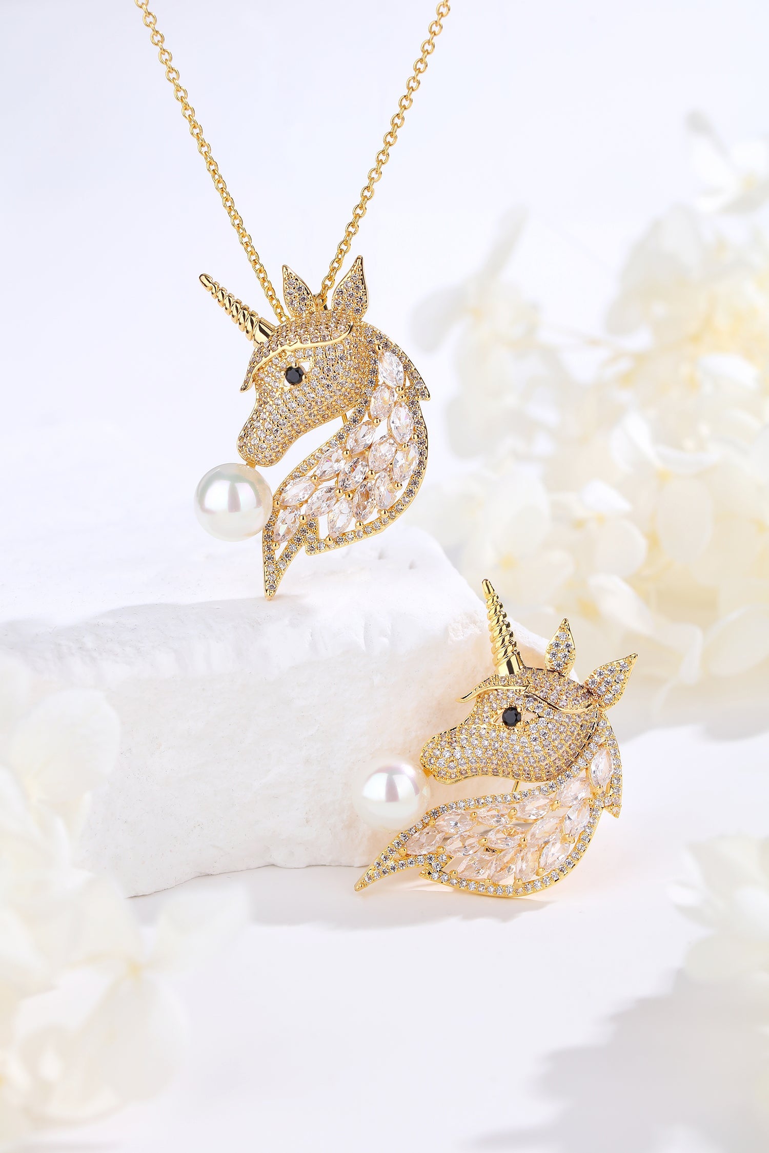 Gold Pavé Unicorn Brooch and Necklace Set featuring Swarovski crystals and a pearl, showcasing a mythical unicorn design.