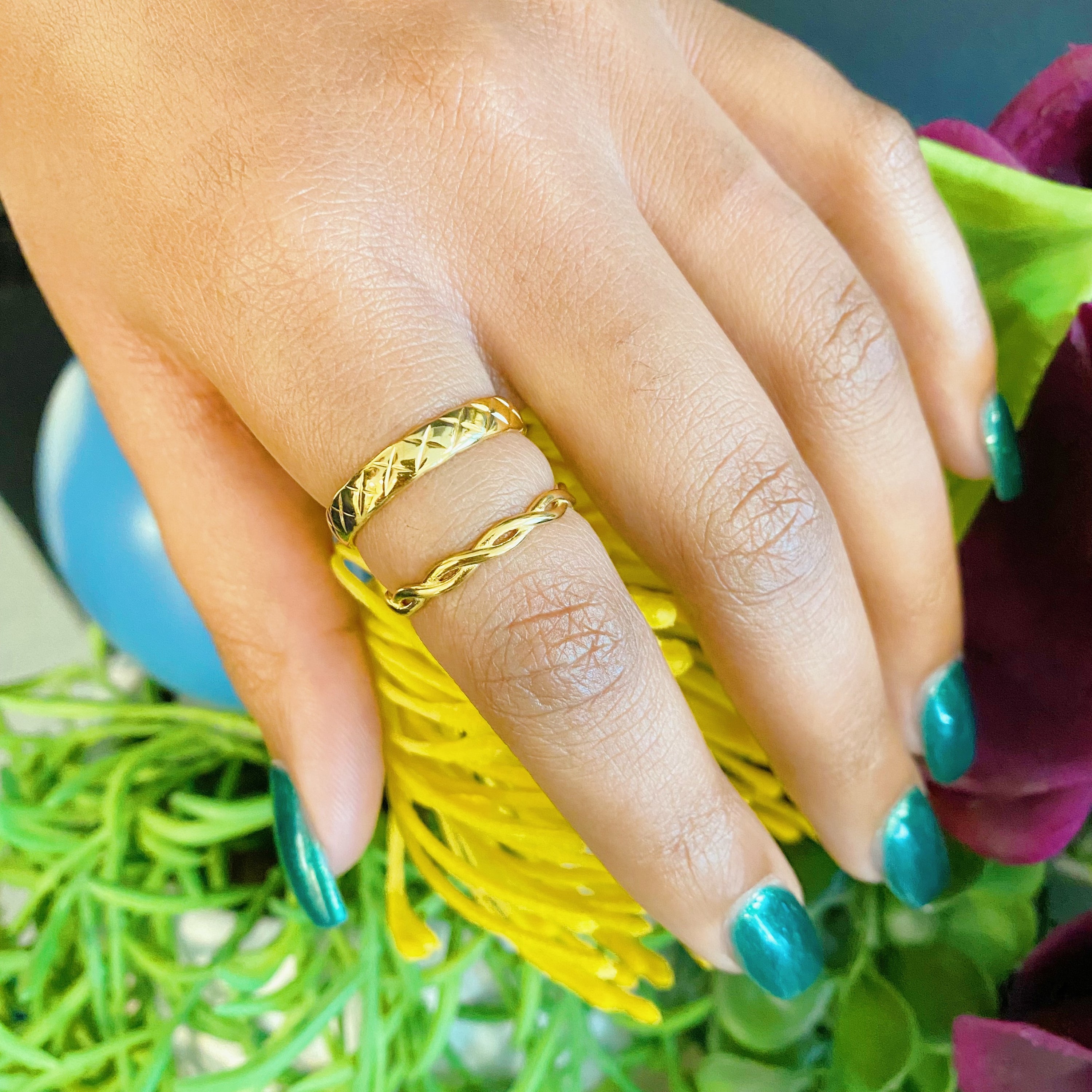 A stylish gold quilted ring made of stainless steel, featuring a textured surface, perfect for layering or wearing alone.