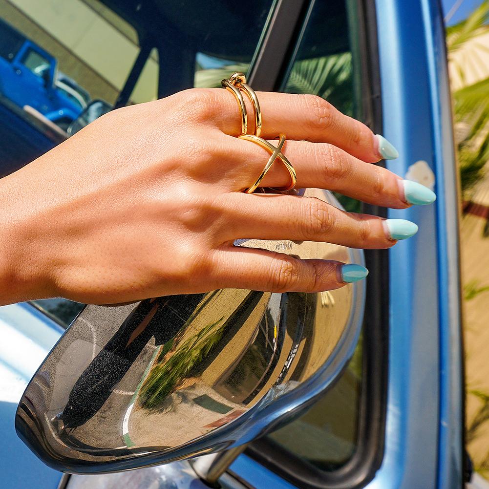 Gold Skinny Crisscross Band Ring made of stainless steel with 14K gold plating, featuring a stylish crisscross design.