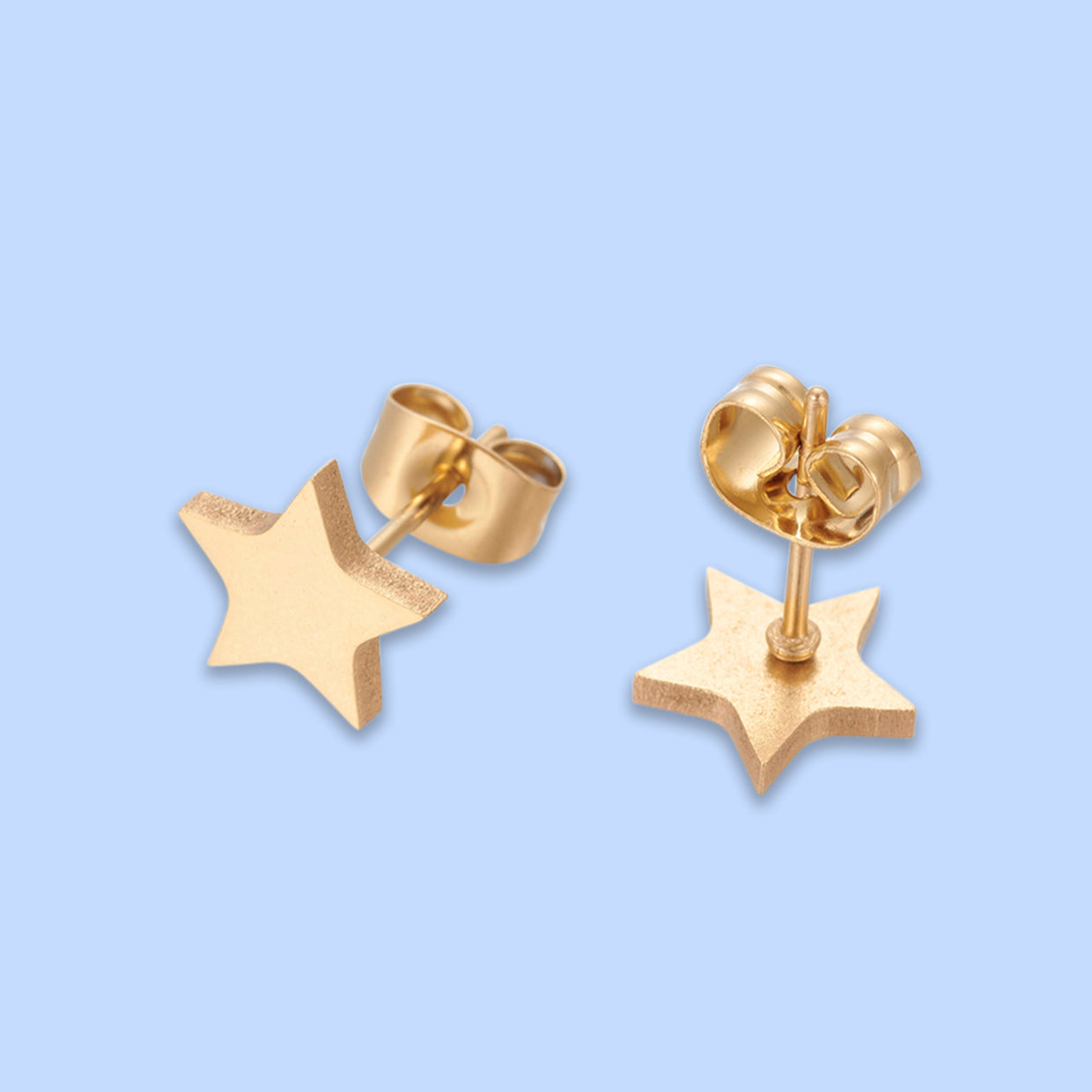 Gold Star Stud Earrings, handmade in the UK, featuring a golden coating on a stainless steel base, presented on a gift card.