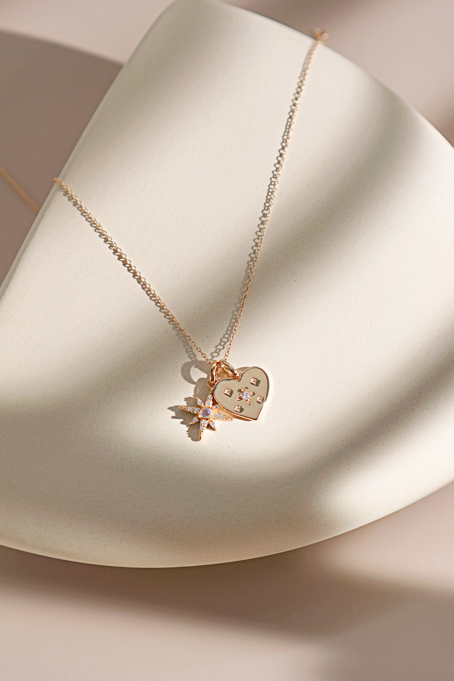 Gold Starry Heart Pendant featuring a heart shape adorned with delicate stars, symbolizing self-love and individuality.