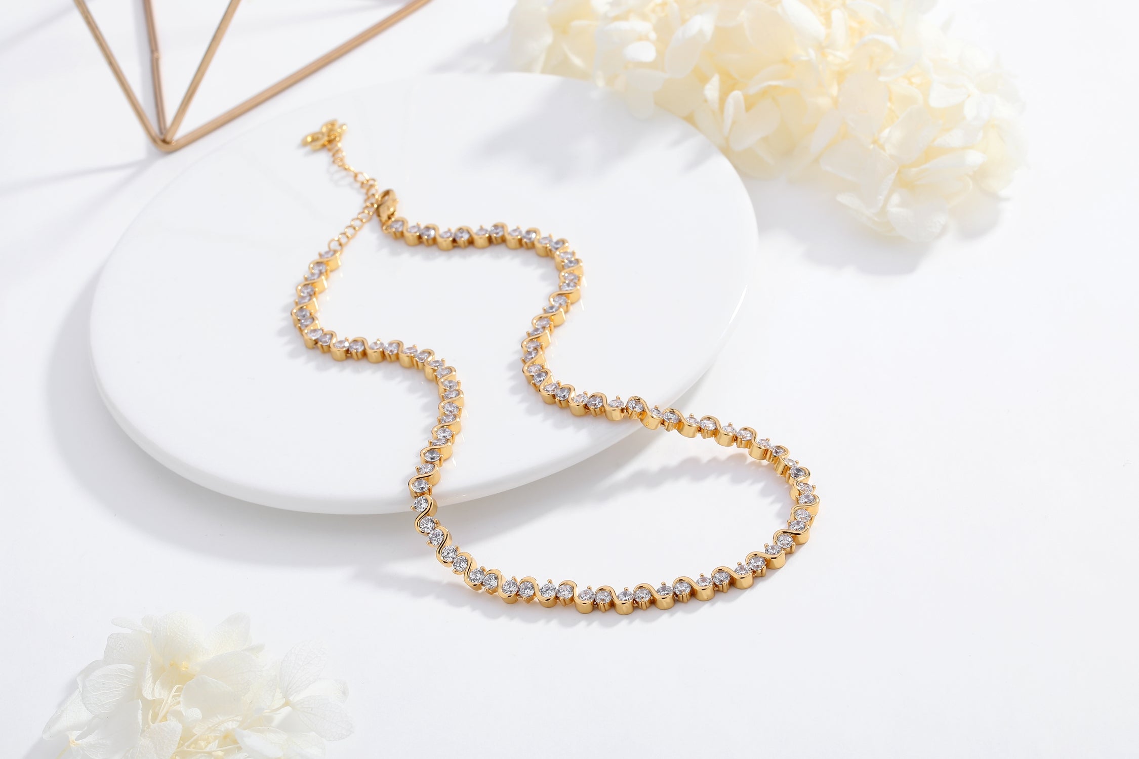 Elegant Gold Wave Zirconia Tennis Choker Necklace with sparkling cubic zirconia stones set in 18K gold plated brass.