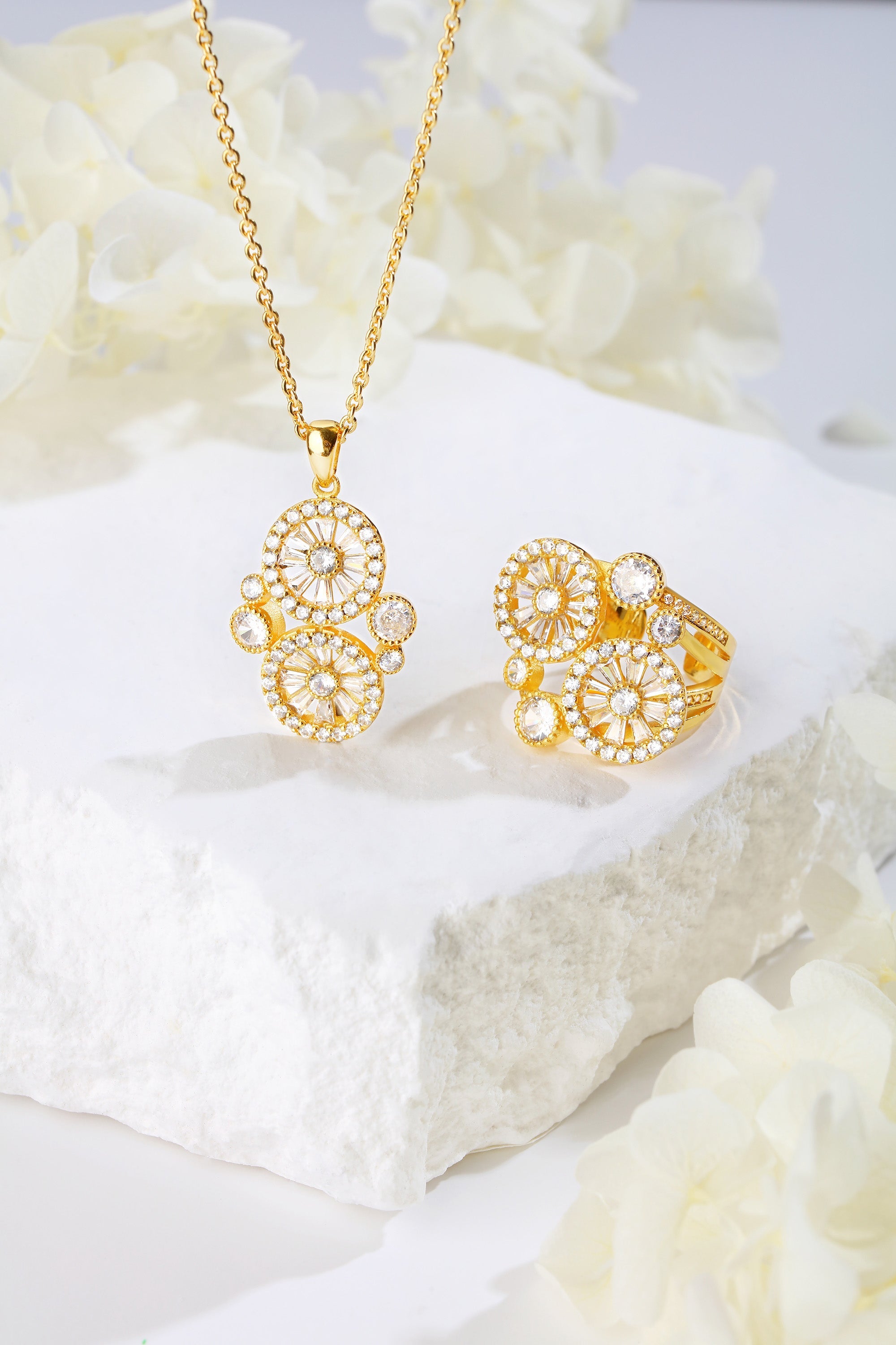 Gold Wheel of Fortune Necklace featuring a unique wheel design with sparkling pavé-set cubic zirconia on an adjustable chain.