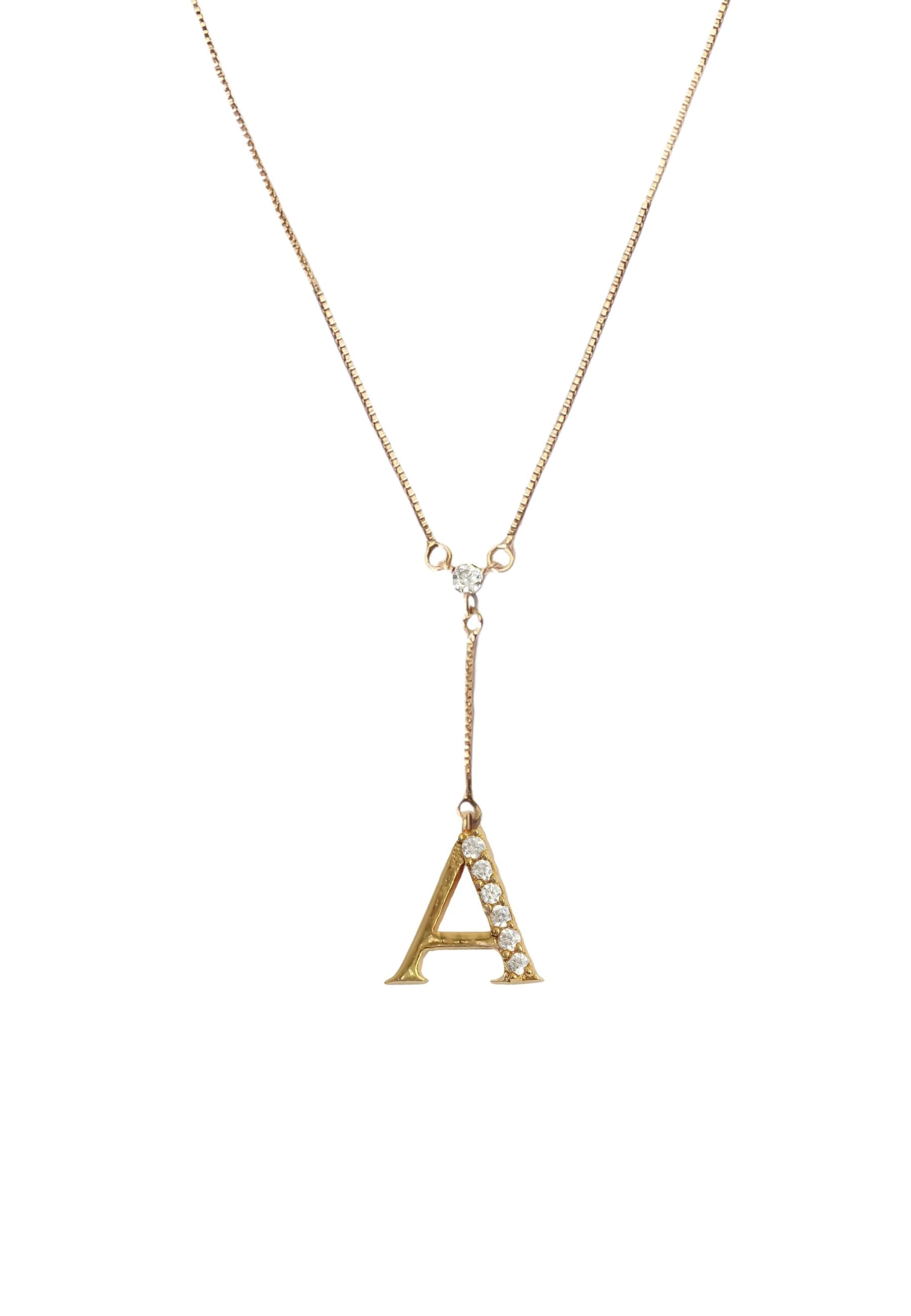 Elegant Golden Alphabet Necklace with zirconia stones, showcasing a personalized initial, perfect for layering or gifting.