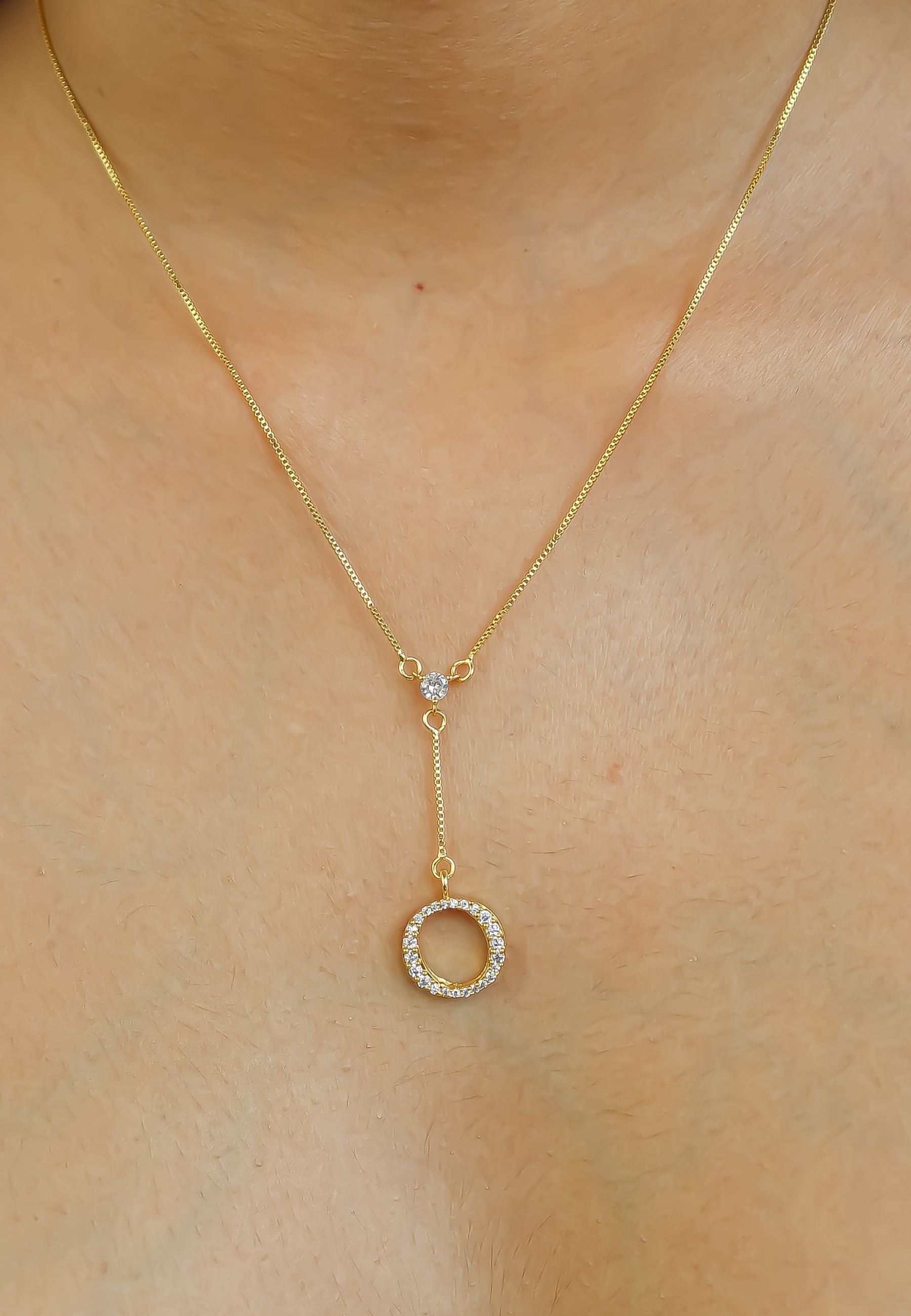 Elegant Golden Alphabet Necklace with zirconia stones, showcasing a personalized initial, perfect for layering or gifting.