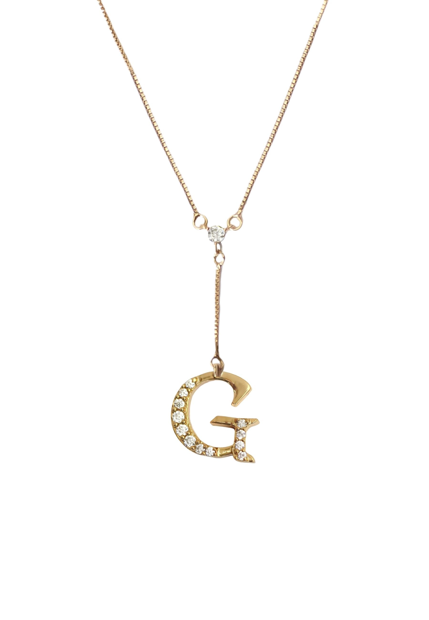 Elegant Golden Alphabet Necklace with zirconia stones, showcasing a personalized initial, perfect for layering or gifting.