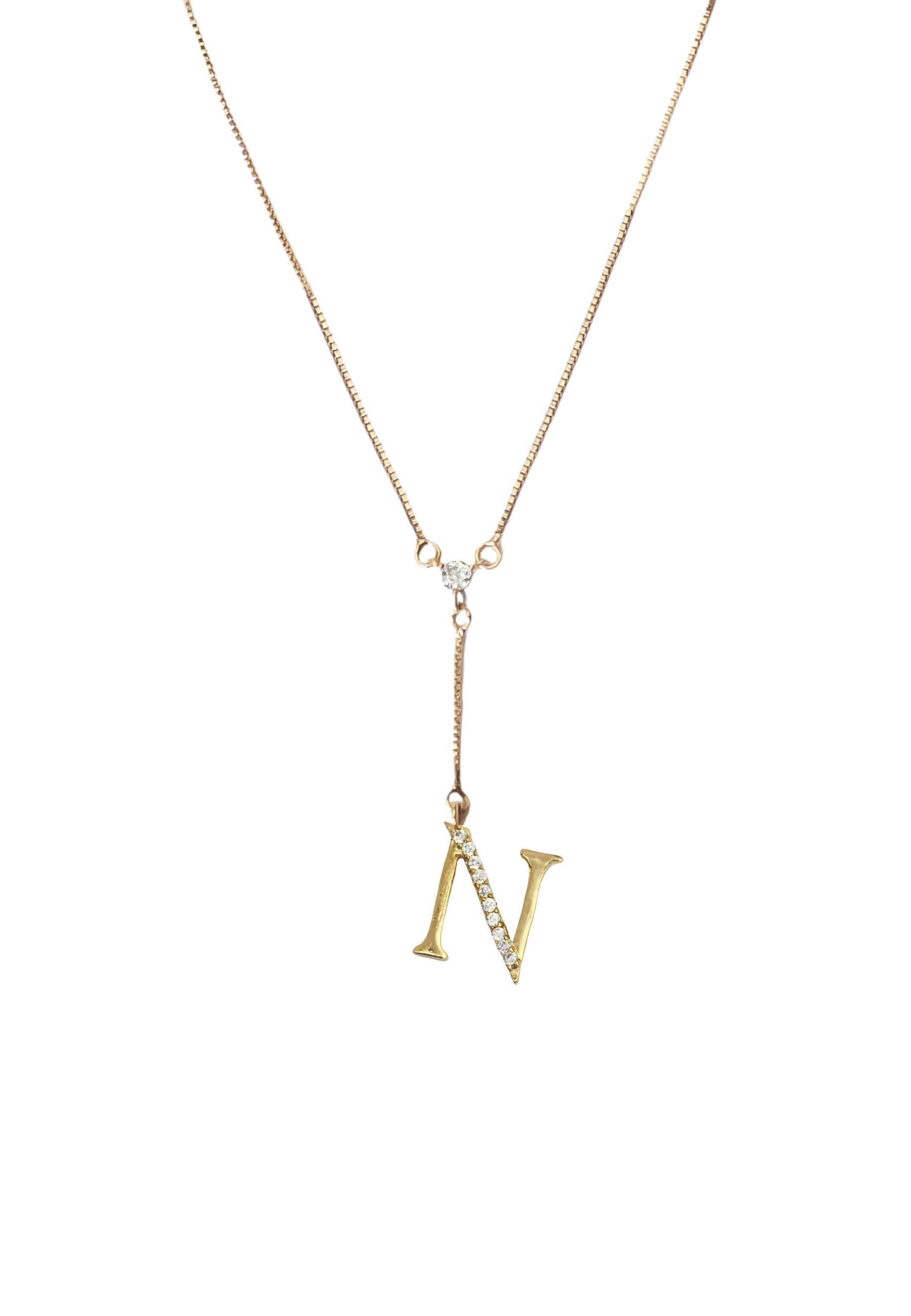 Elegant Golden Alphabet Necklace with zirconia stones, showcasing a personalized initial, perfect for layering or gifting.