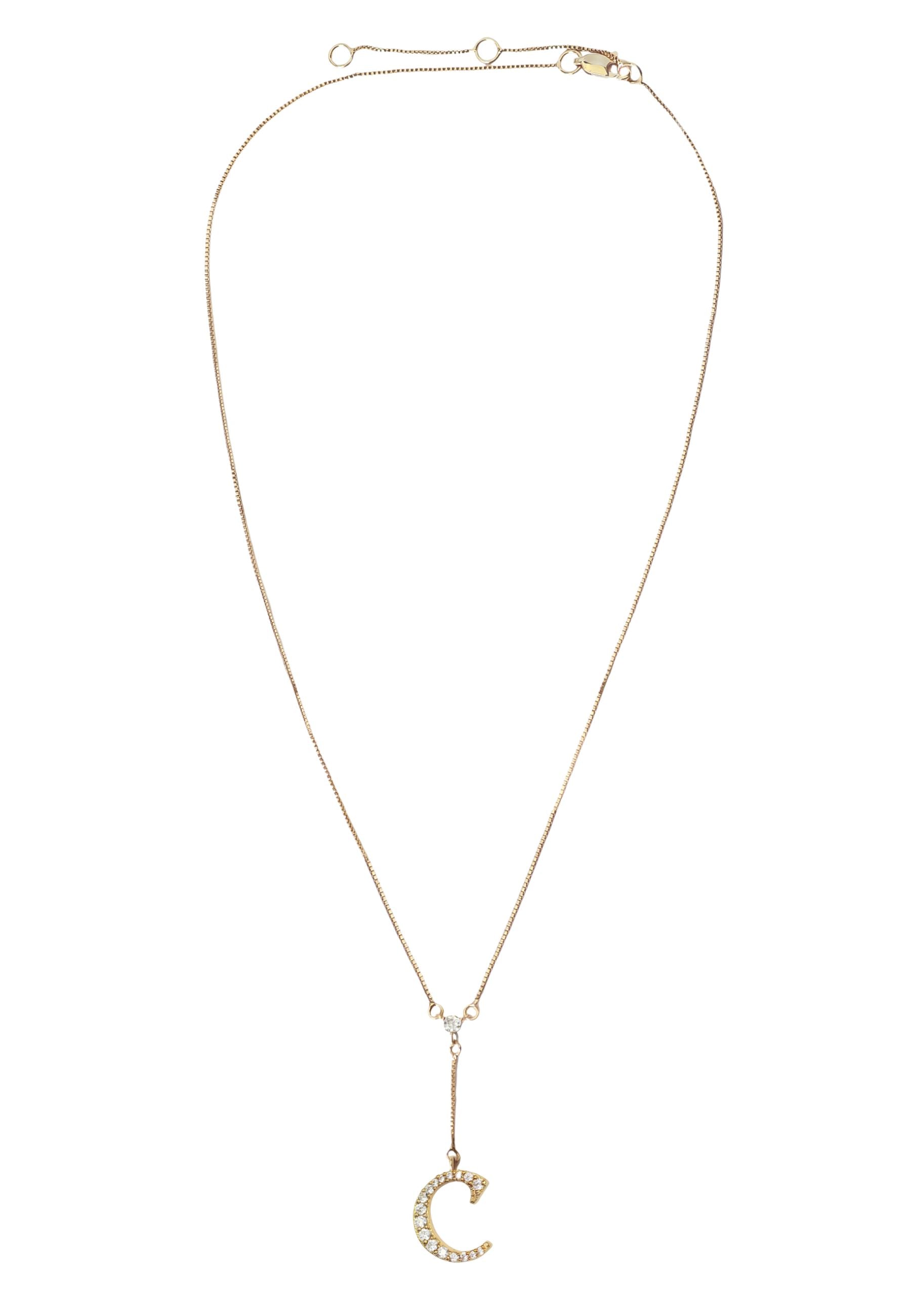 Elegant Golden Alphabet Necklace with zirconia stones, showcasing a personalized initial, perfect for layering or gifting.