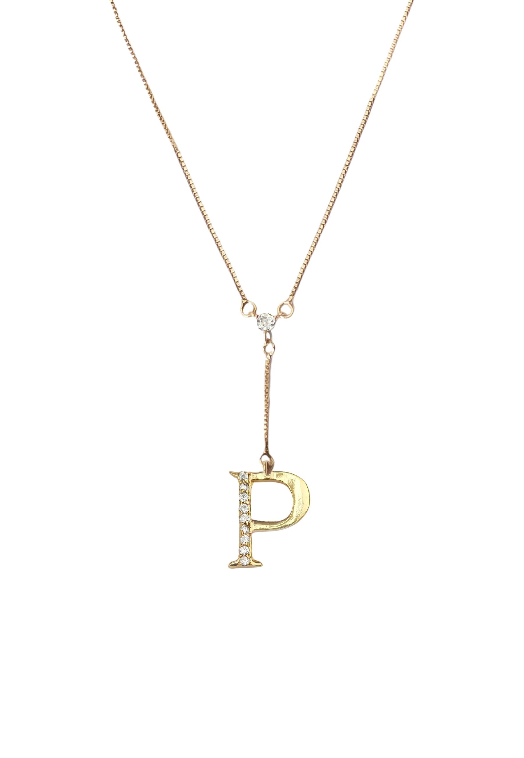 Elegant Golden Alphabet Necklace with zirconia stones, showcasing a personalized initial, perfect for layering or gifting.