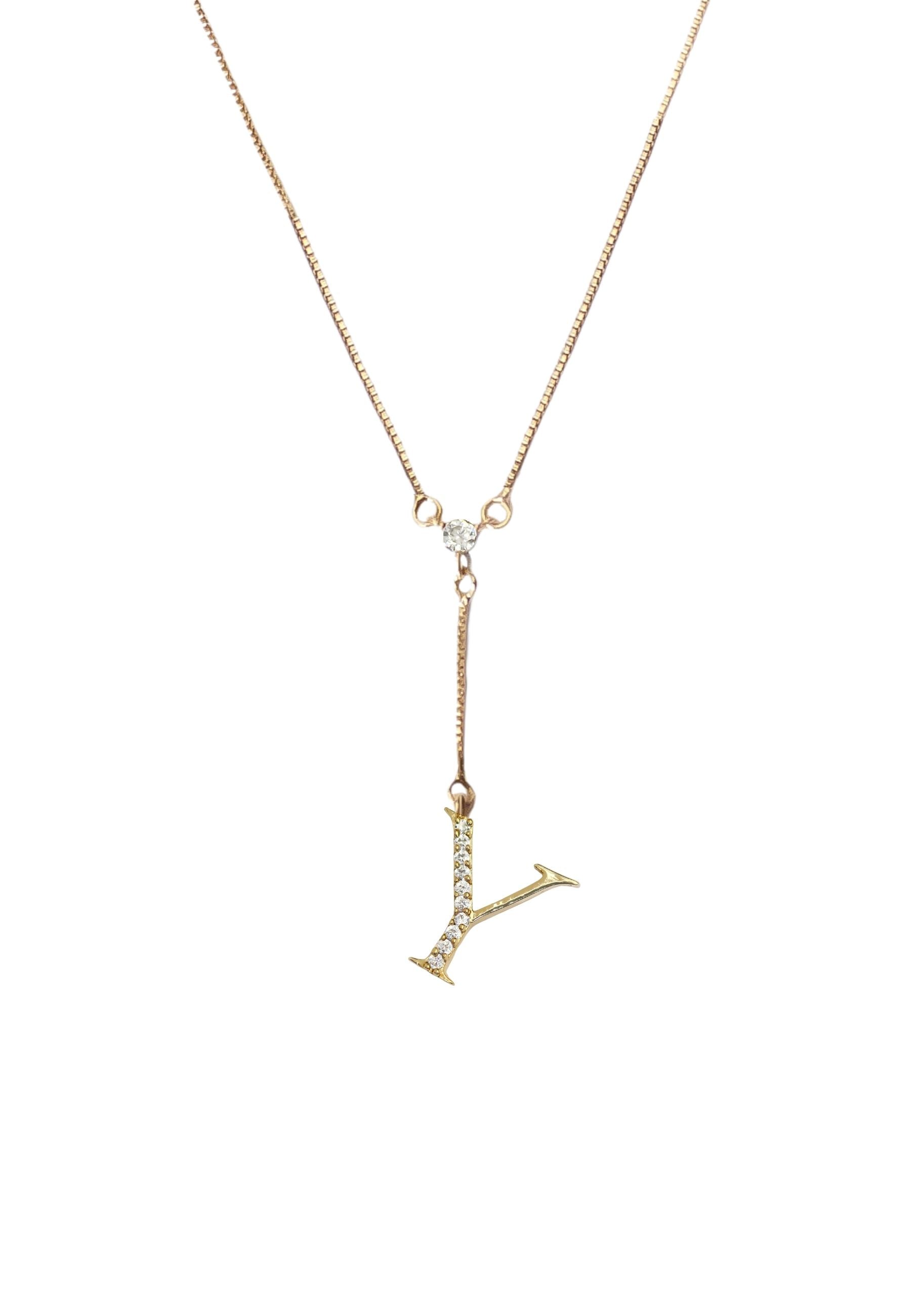 Elegant Golden Alphabet Necklace with zirconia stones, showcasing a personalized initial, perfect for layering or gifting.