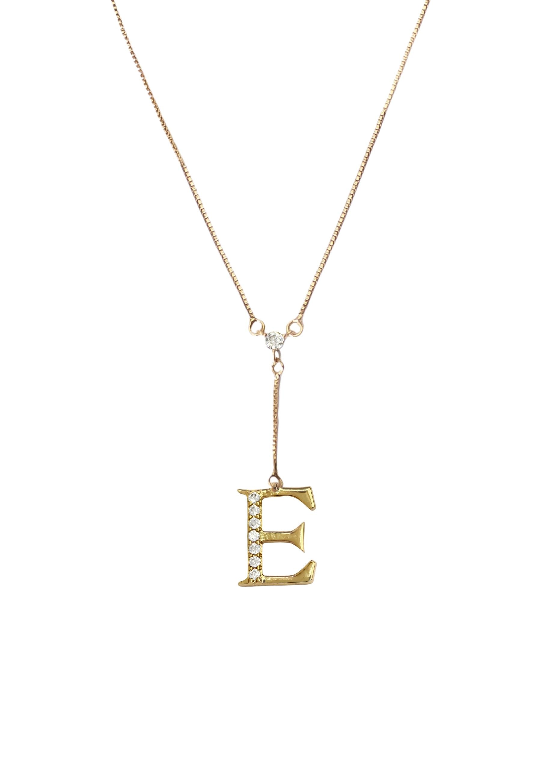 Elegant Golden Alphabet Necklace with zirconia stones, showcasing a personalized initial, perfect for layering or gifting.