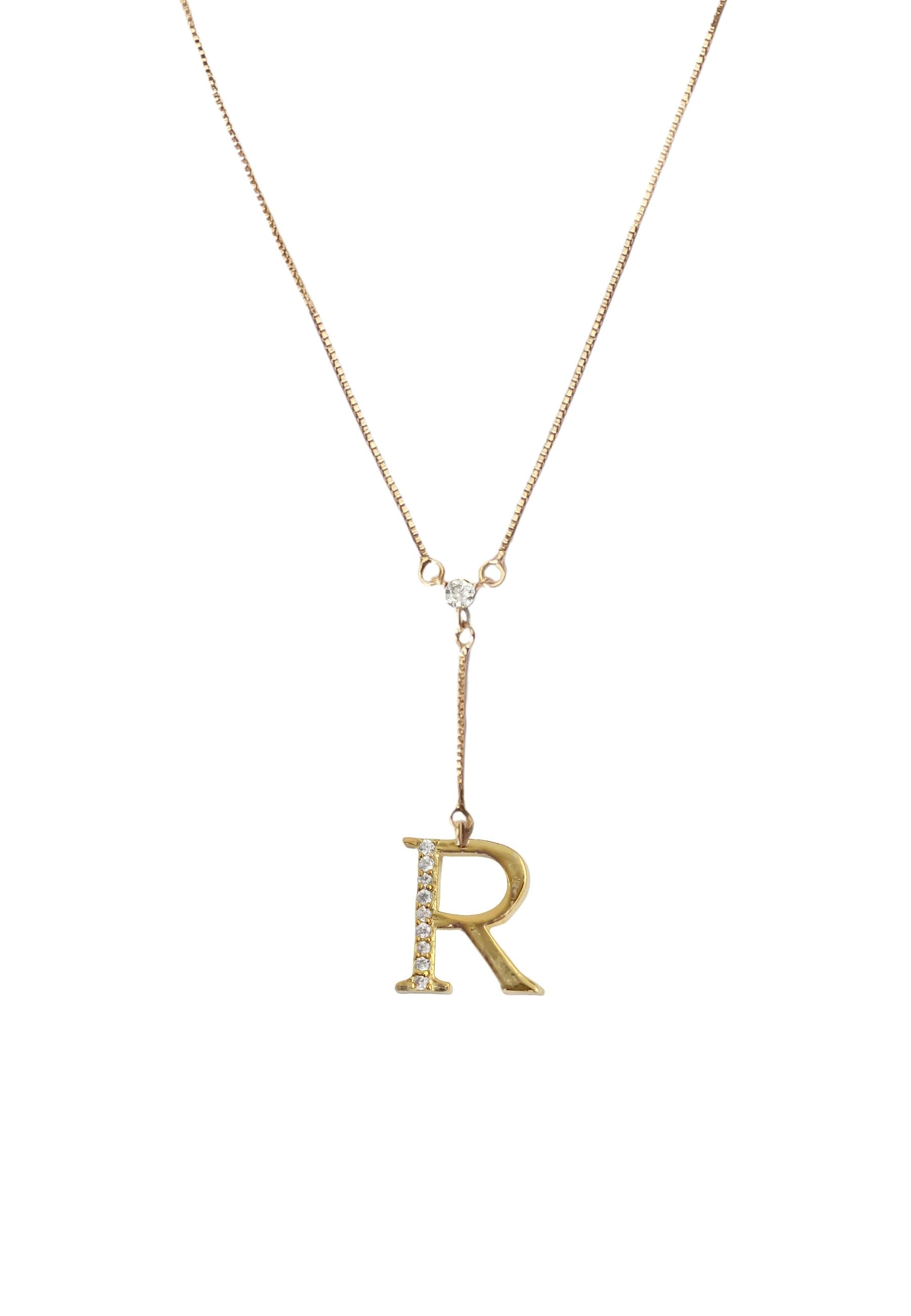 Elegant Golden Alphabet Necklace with zirconia stones, showcasing a personalized initial, perfect for layering or gifting.