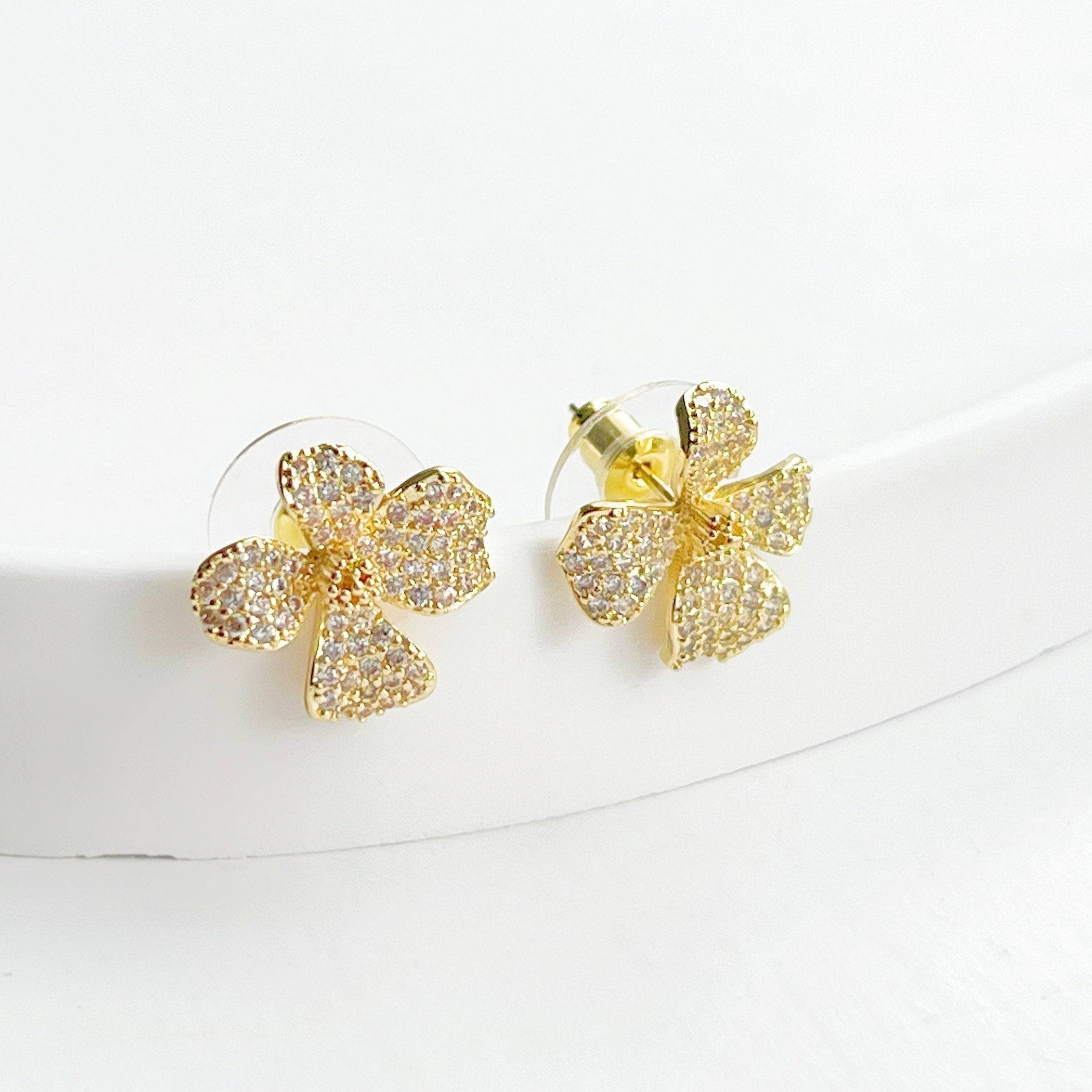 Golden Four Petals Shamrock Earrings featuring gold-plated bronze, sterling silver studs, and sparkling artificial crystals.